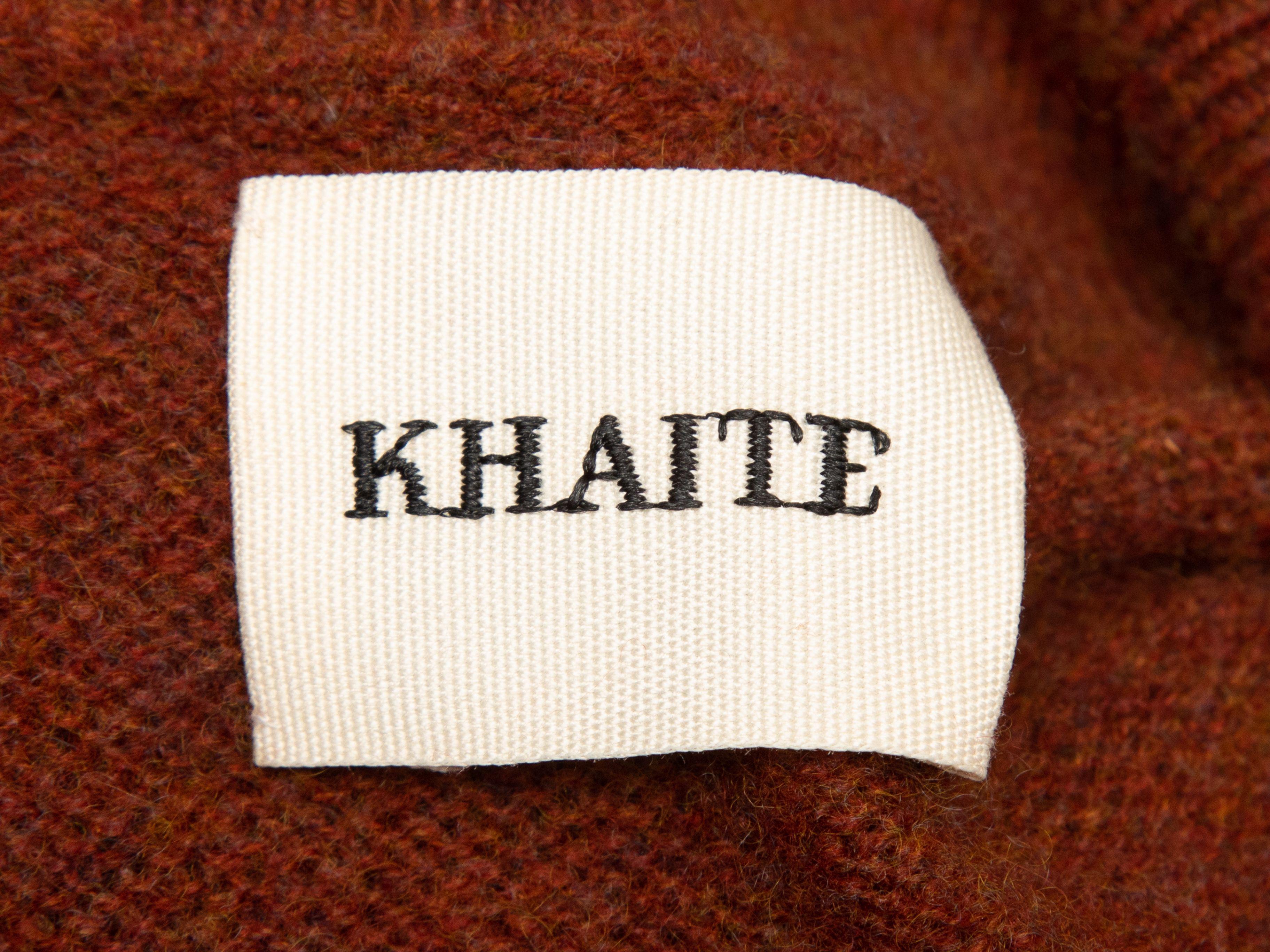 Product Details: Burnt orange cashmere sweater by Khaite. Mock neck. Long sleeves. 40