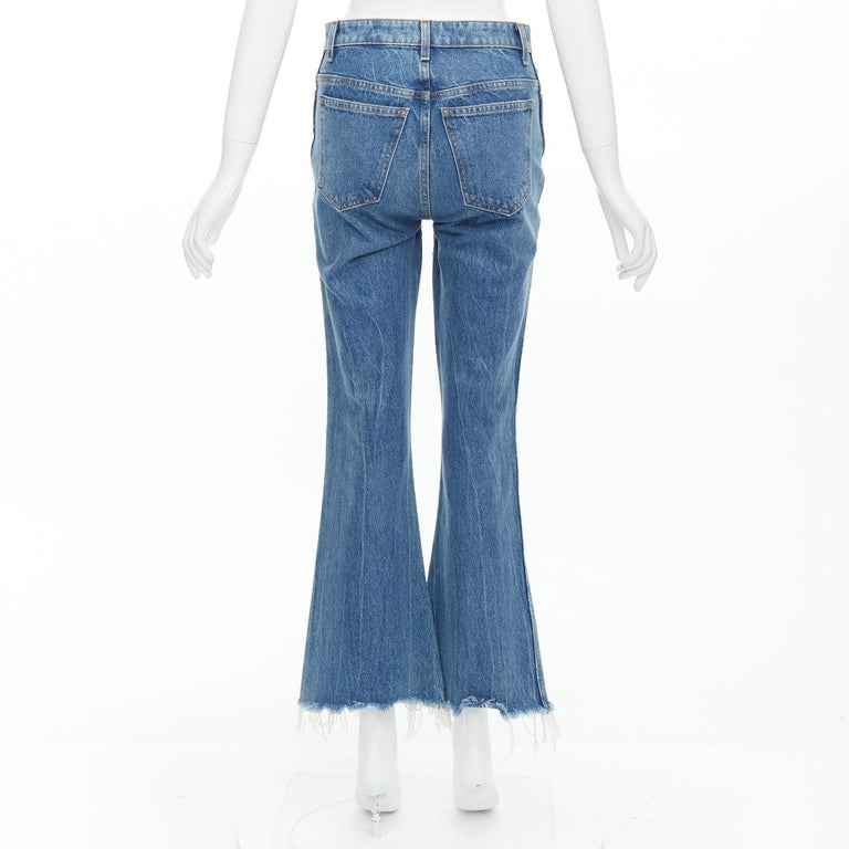 KHAITE Gabbie blue stone washed resin button flare cropped jeans