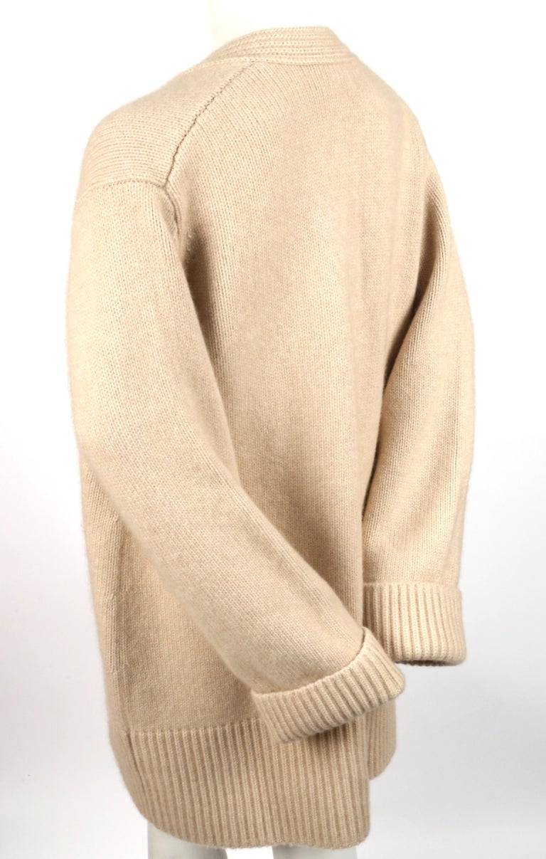 KHAITE 'LUCIA' oversized cashmere cardigan sweater with patch pockets in sand KHAITE 'LUCIA' oversized cashmere cardigan sweater with patch pockets in sand