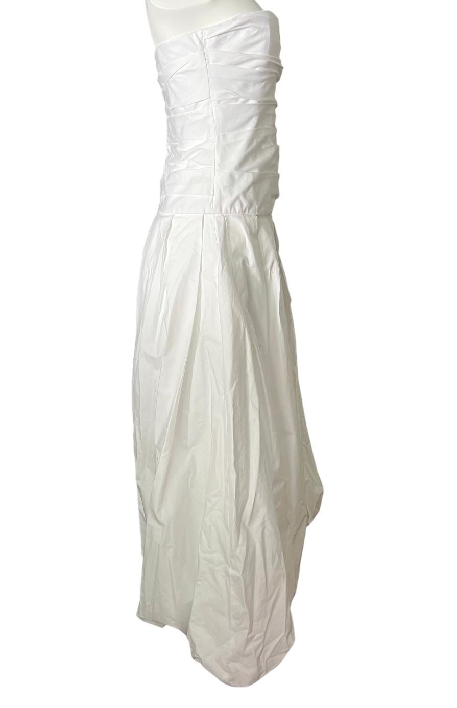 - Sleeveless
- Floor length
- Ruffled and flare design
- Concealed rear zip closure with hook
- Side pocket detail
