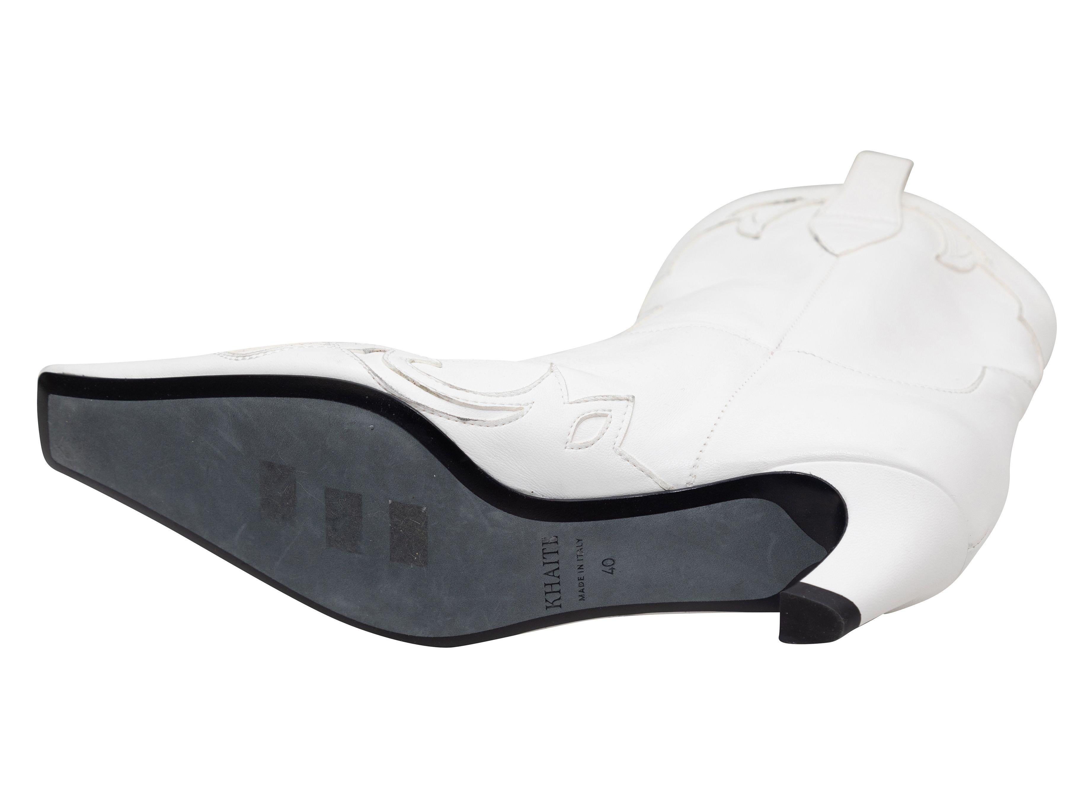 Product Details: White leather western boots by Khaite. Square toes. Kitten heels. 2