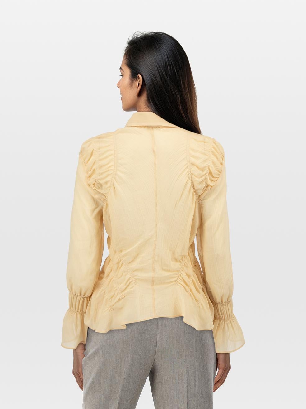 CONDITION is Very Good. Hardly any visible wear to blouse is evident on this used Khaite designer resale item.
 
 
 
 Details
 
 
 Yellow
 
 Wool
 
 Blouse
 
 Sheer
 
 Long sleeves
 
 Button up fastening
 
 Ruched details
 
 
 
 
 
 Made in Turkey

