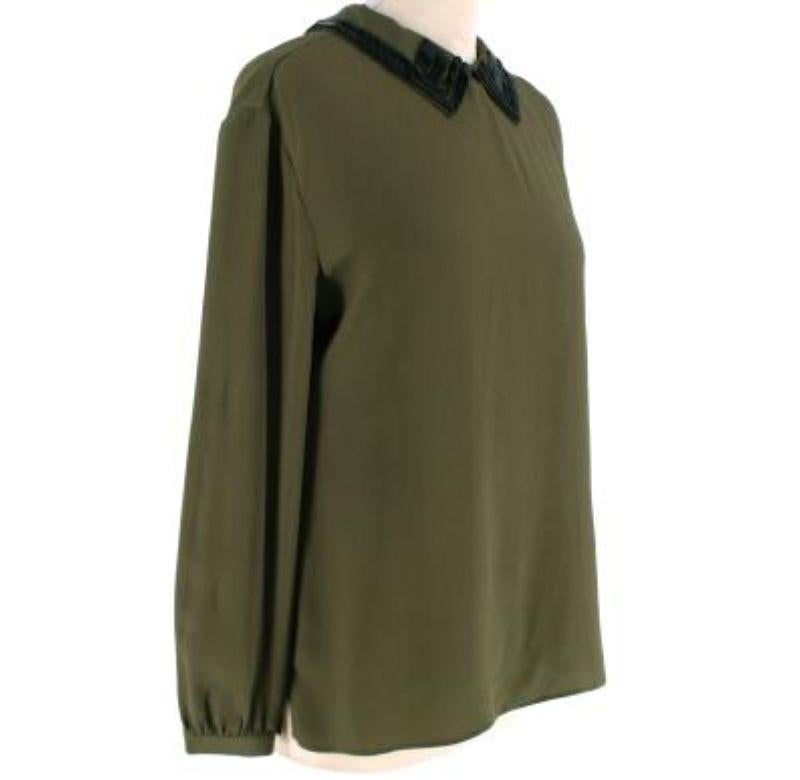 Prada Khaki Silk Crepe Embellished Collar Blouse
 
 - Silk blouse with black bead embellished collar
 - Long sleeve, button finished cuffs
 - Back button-up closure 
 
 Materials
 100% Silk 
 
 Made In Italy 
 Dry Clean Only 
 
 9.5 Excellent