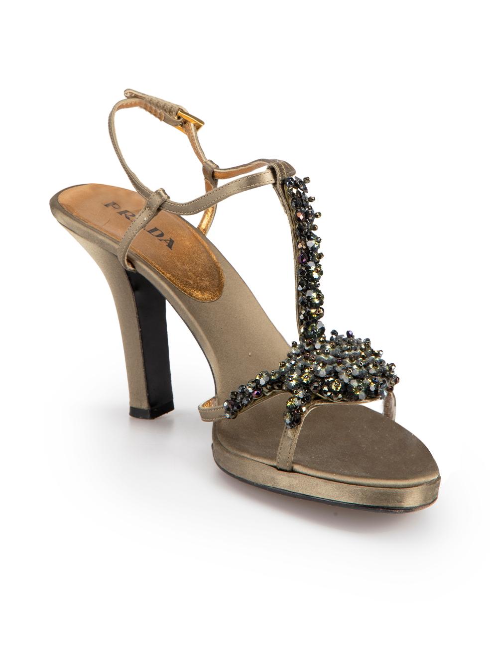CONDITION is Good. Minor wear to shoes is evident. Light wear to both platforms with pulls to the weave and left-shoe toe with small marks on this used Prada designer resale item.



Details


Khaki

Silk satin

Heeled sandals

Floral bead