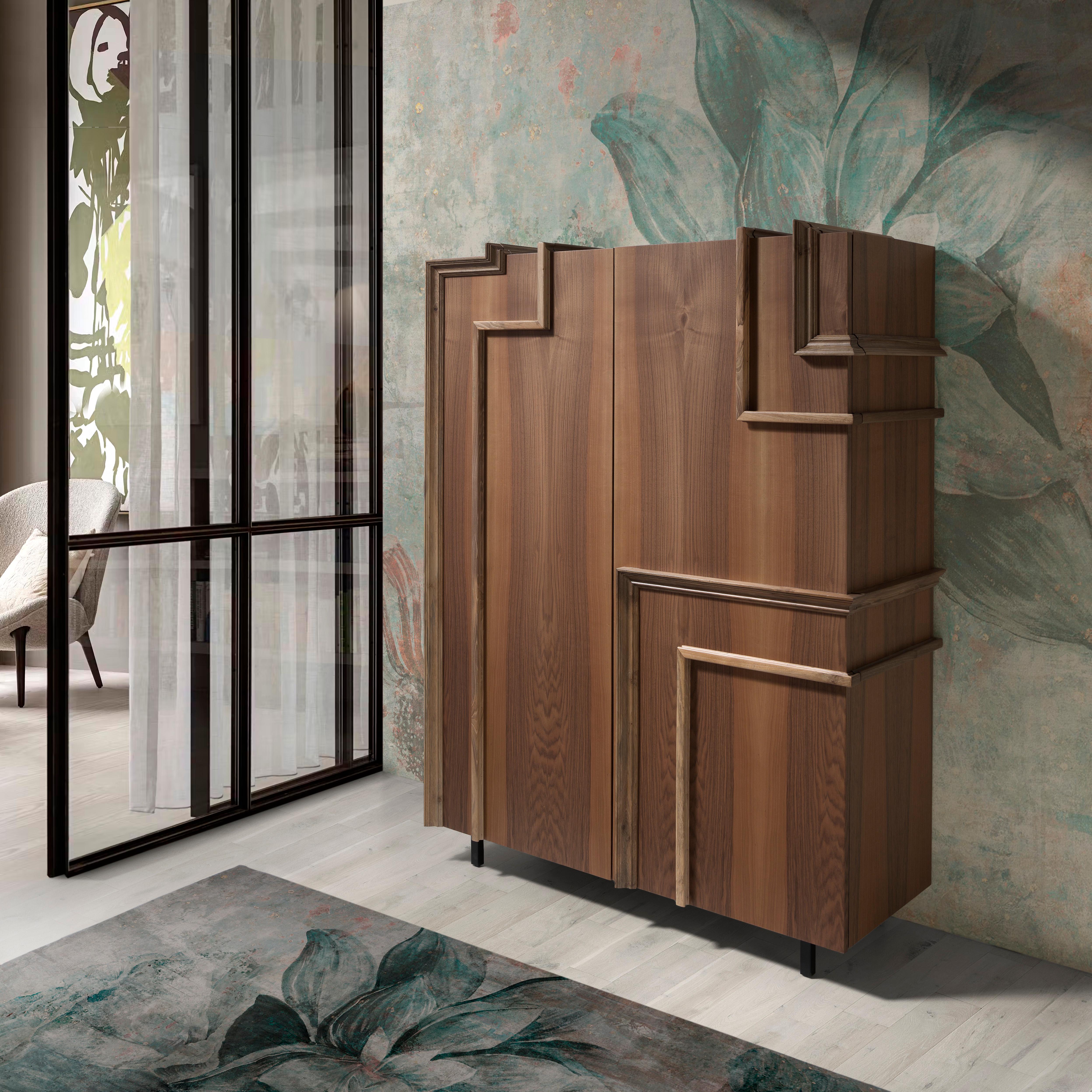 Armario de madera Khalo by Lola Glamour
Dimensiones: P 45 x An 120 x Al 150 cm
Materiales: Madera.

Tiene una piel de madera de nogal y un conjunto de molduras en relieve que recorren su cuerpo y dirigen nuestra mirada. Su diseño atemporal y su