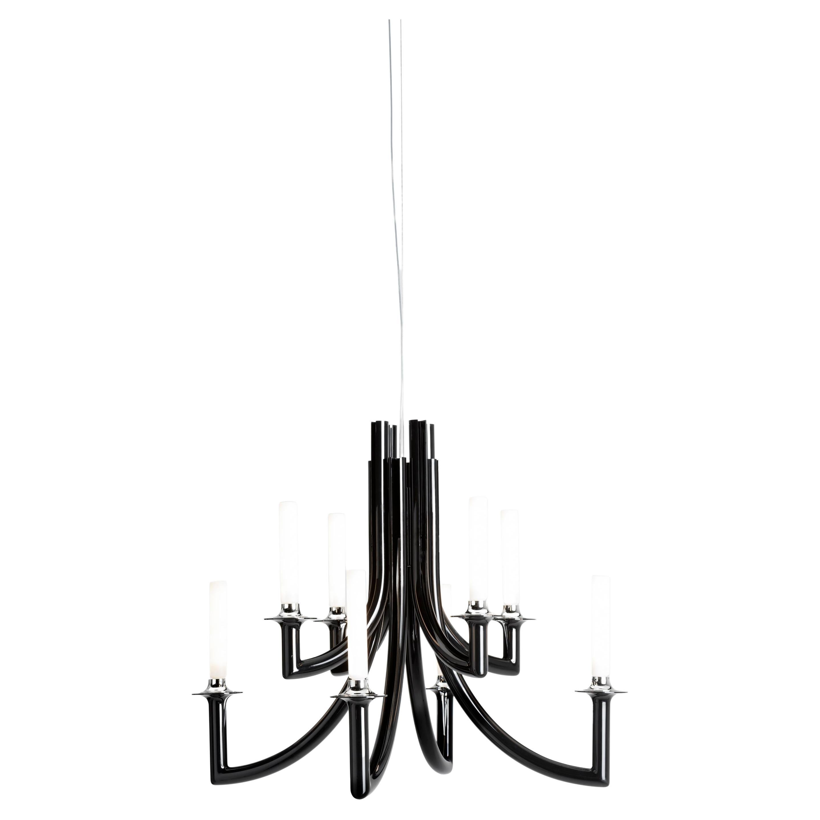 Many different styles, from 18th century eclecticism to contemporary minimalism, come together in Philippe Starck’s KHAN chandelier to create a new icon of elegance and modernity. 
The symbolism of the design is complemented by the technological