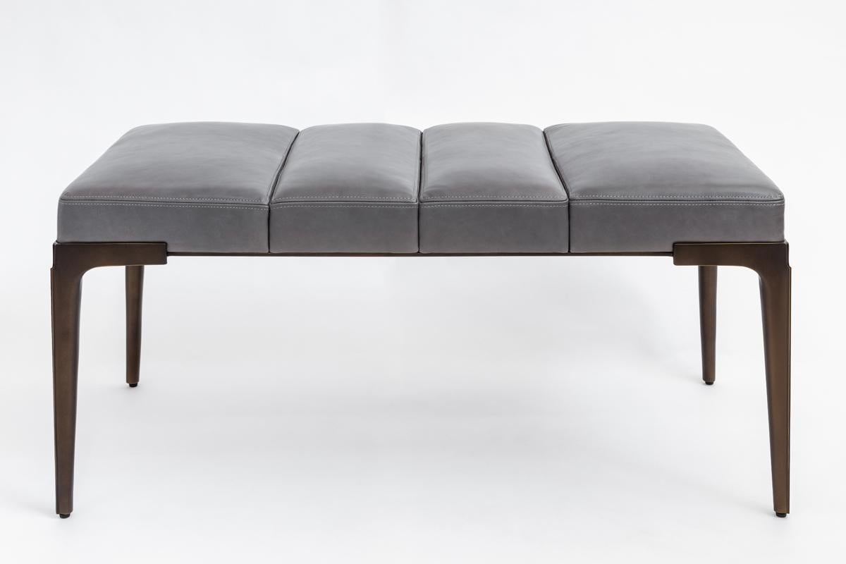 Khepera bench’s slender and statuesque cast legs with their distinctive ridge detail tapers down the legs elevate its well-proportioned sectioned upholstery as though hovering above the ground. A making it a refined sculptural addition to any space.