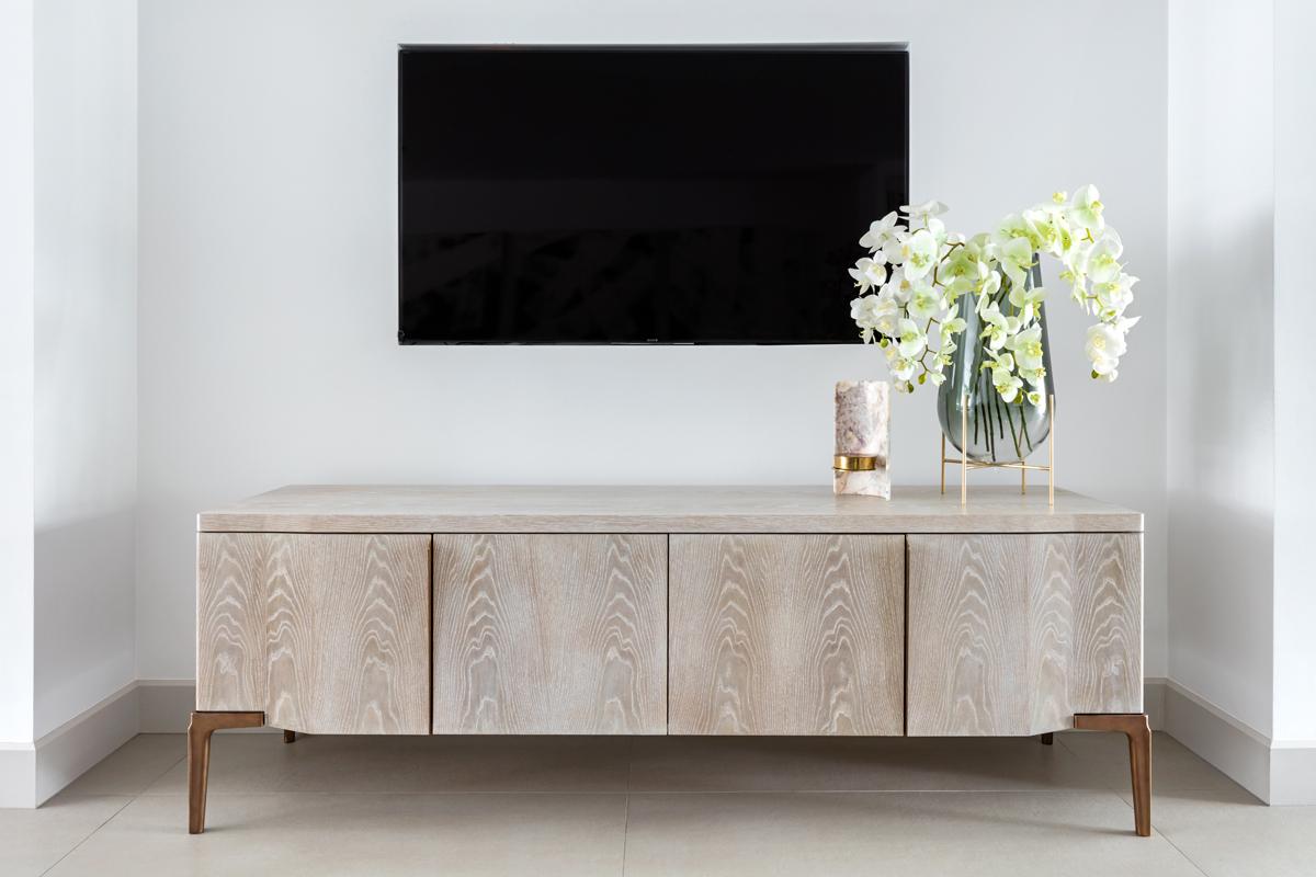 Khepera Credenza’s undulating door fronts and subtle pull reference the language of its slender and statuesque cast legs with their distinctive ridge detail which tapers down their length.   This well-proportioned credenza also incorporates cable