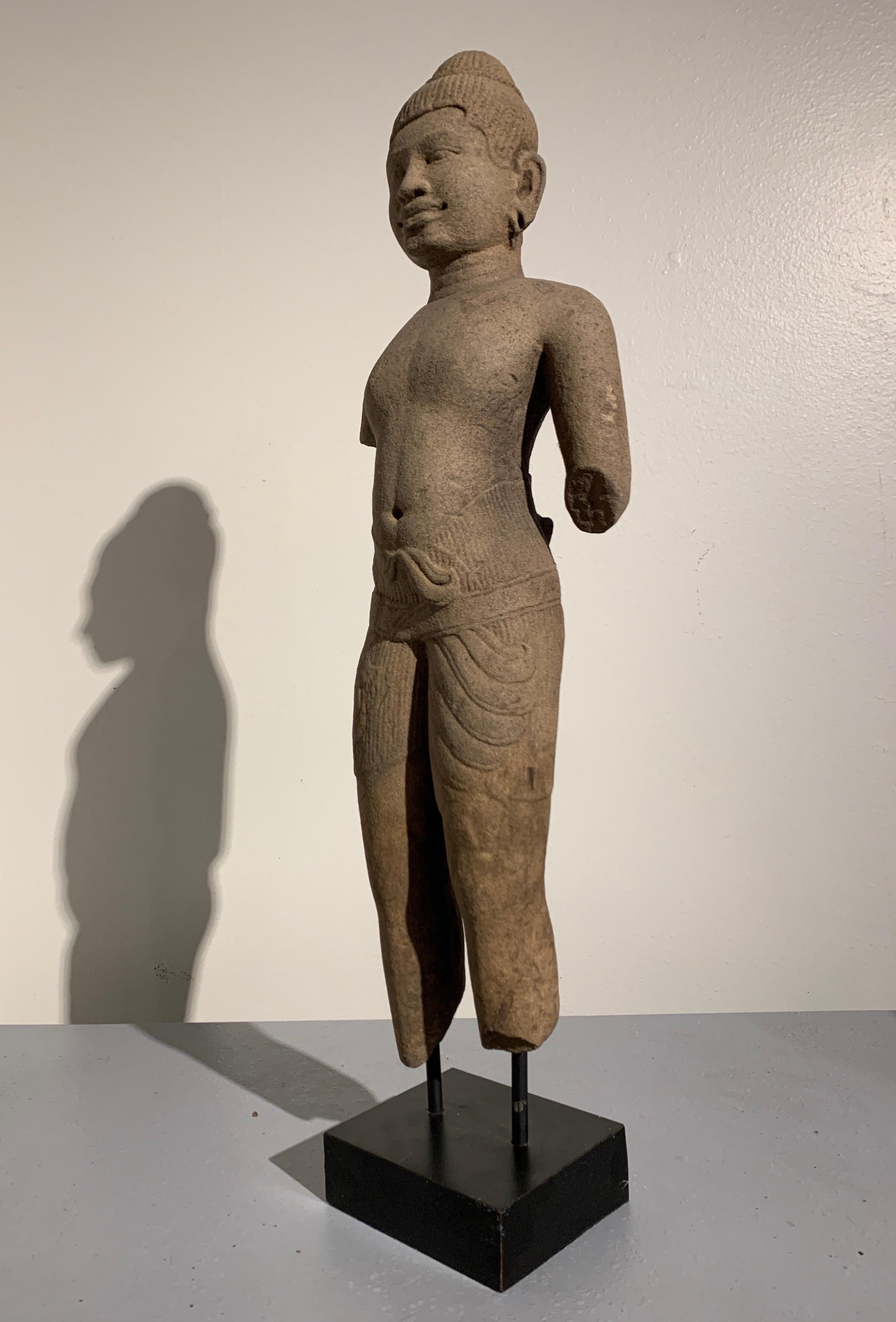 Hand-Carved Khmer Carved Sandstone Male Deity, Style of the Baphoun, 11th Century For Sale