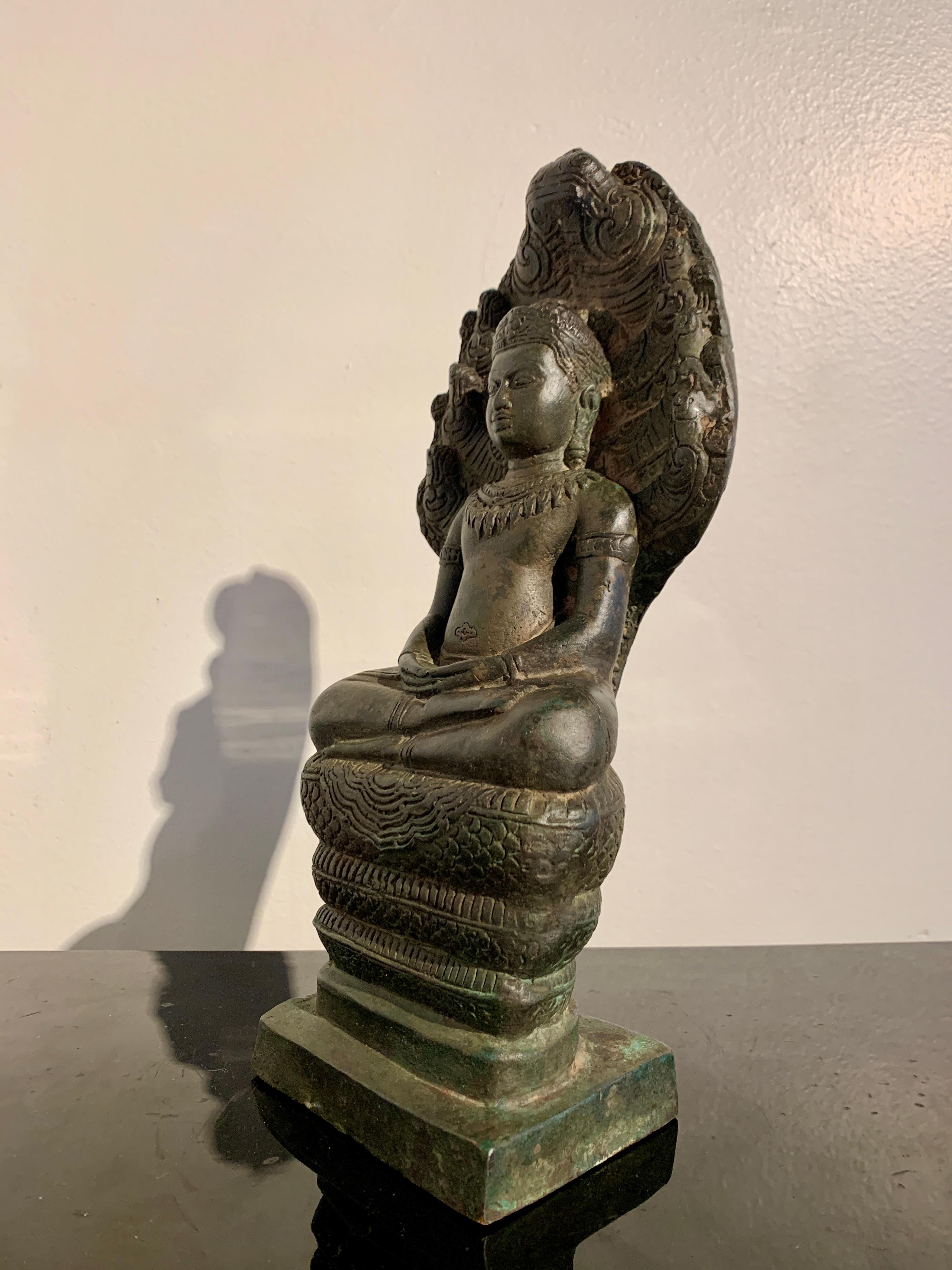 Khmer Cast Bronze Buddha Sheltered by Naga, 19th Century, Cambodia  In Good Condition For Sale In Austin, TX