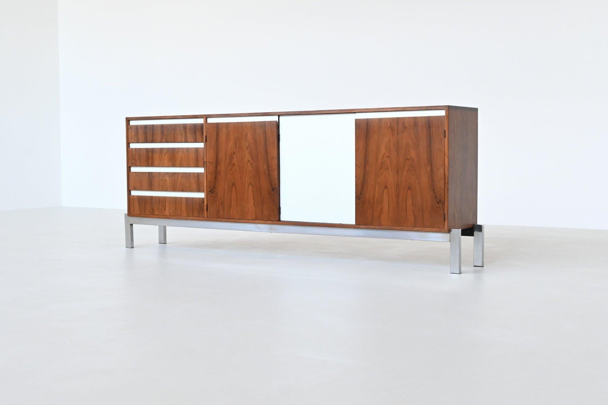 Beautiful shaped modernist sideboard from the J-Series model JDL 255 designed by Kho Liang Ie and Wim Crouwel for Fristho Franeker, The Netherlands 1957. This fantastic sideboard is executed in amazingly grained rosewood supported by a chrome plated