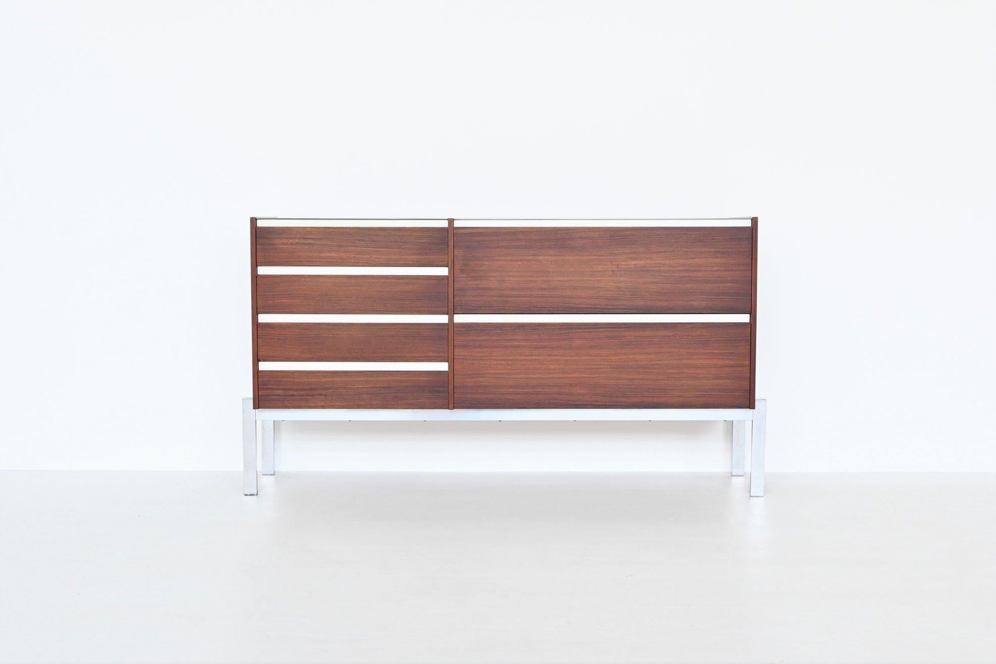 Beautiful shaped modernist sideboard designed by Kho Liang Ie and Wim Crouwel and manufactured by Fristho Franeker, The Netherlands 1957. This fantastic sideboard is executed in nicely grained rosewood supported by a chrome plated metal frame. Very