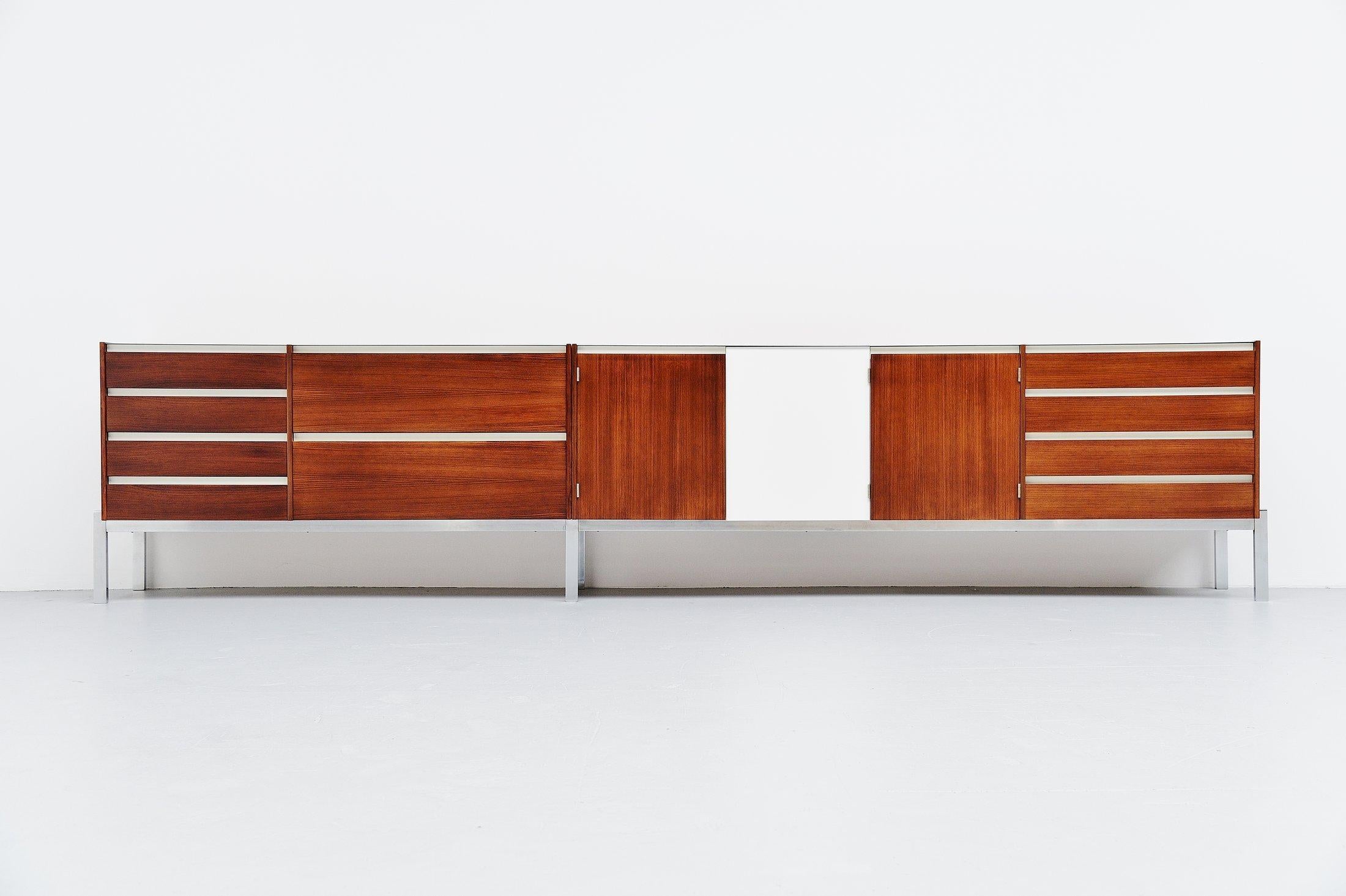 Rare custom made super long sideboard from the J-Series model JDL 255 which was designed by Kho Liang Ie & Wim Crouwel and manufactured by Fristho, Franeker 1957. This fantastic rosewood sideboard has nice details, matt chrome plated metal frame,