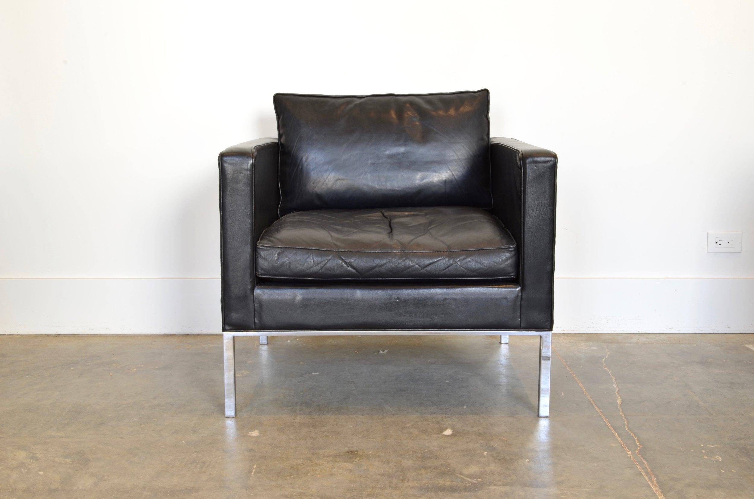 An original Kho Liang Armchair for Artifort.

Materials: Black leather body and cushions with brushed steel base. Character enhanced by patina and wear.

Approx 31”w x 31”d x 25”h Seat height: 28”h.