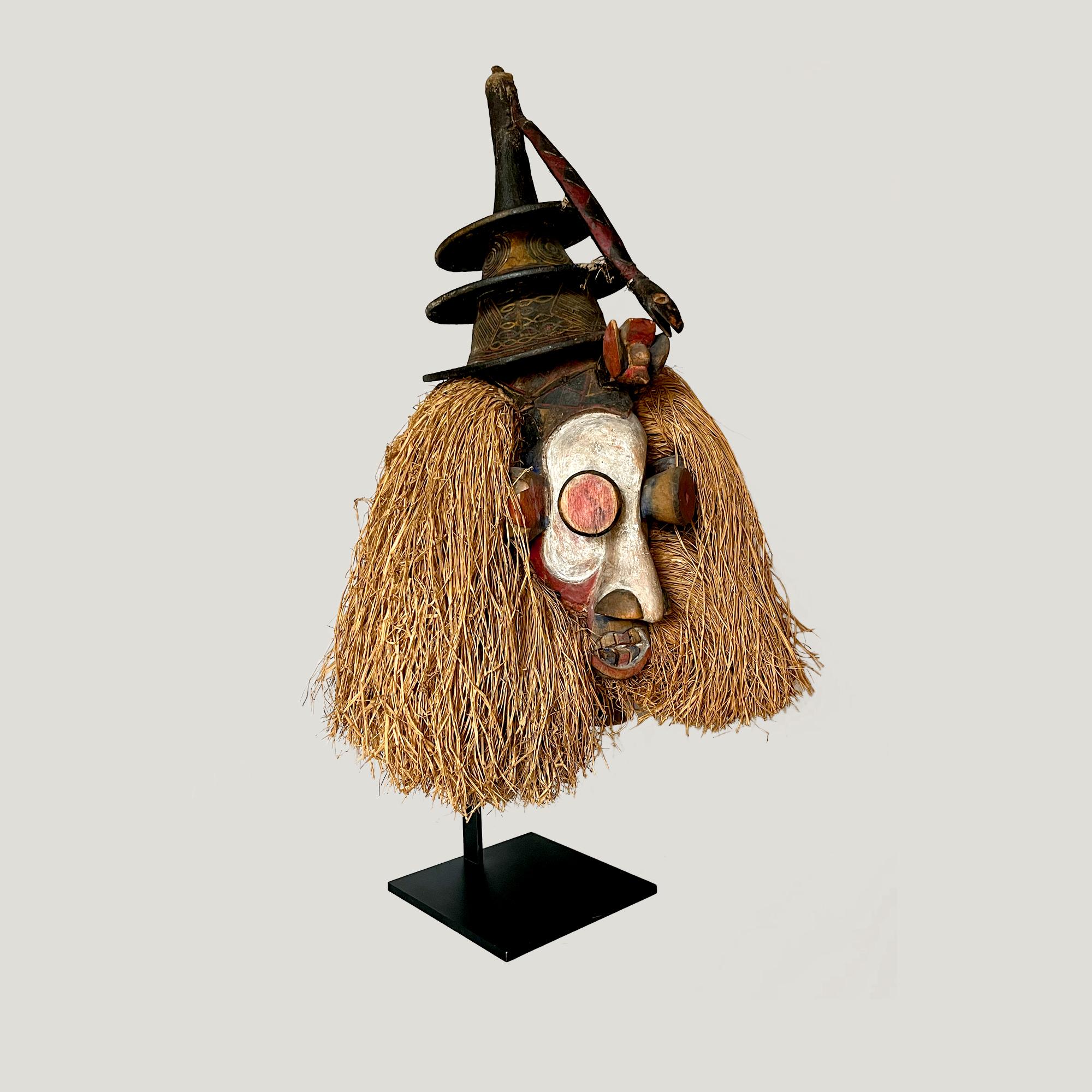 Kholuka Yaka Mask, DR Congo.
Wood, basketry, textile, raffia.

Typical African mask of the Yaka in the south of the Democratic Republic of Congo. The Kholuka Yaka Mask was used in the context of boys' initiation rites. The mask allowed them to be