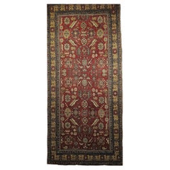 Khotan-Teppich mit geometrischem Allover-Muster auf Ziegelrot, Gelb und Elfenbein