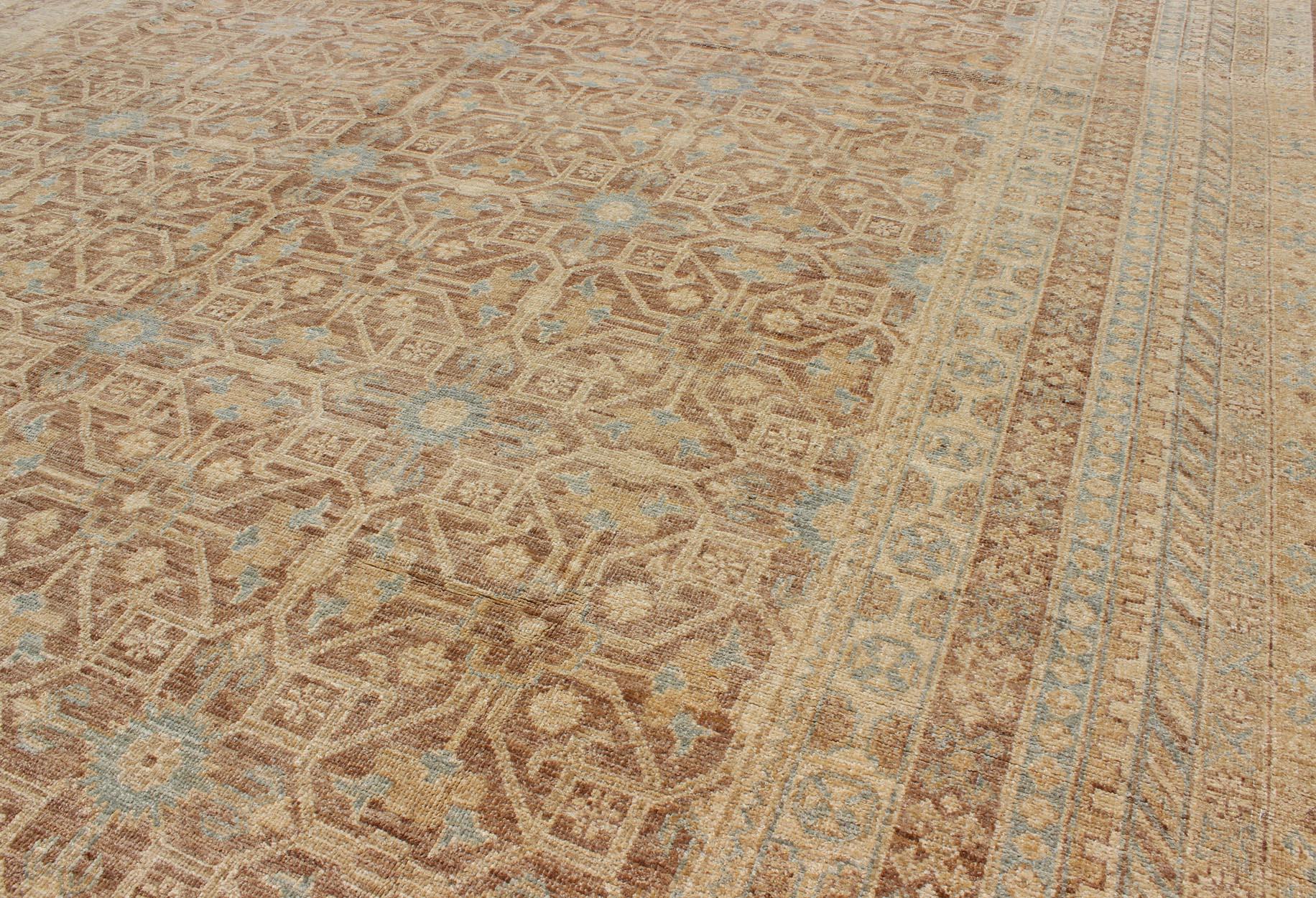 This Khotan features a geometric all-over design flanked by a repeating pattern in the border. The entirety of the piece is rendered in light neutral tones, which makes it a versatile rug, well-suited for a variety of interiors. Colors included are