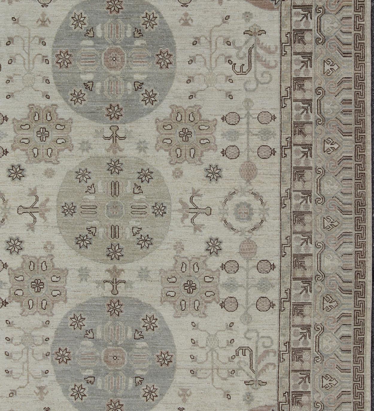 Measures: 9'1 x 12'4.
Light color Khotan rug, Afghanistan made fine piece, with circular Medallions in Gray, Tan, Cream, brown and light blue. Khotan Design Rug with Circular Medallions by Keivan Woven Arts / rug/MP-1703-1613 country of origin /