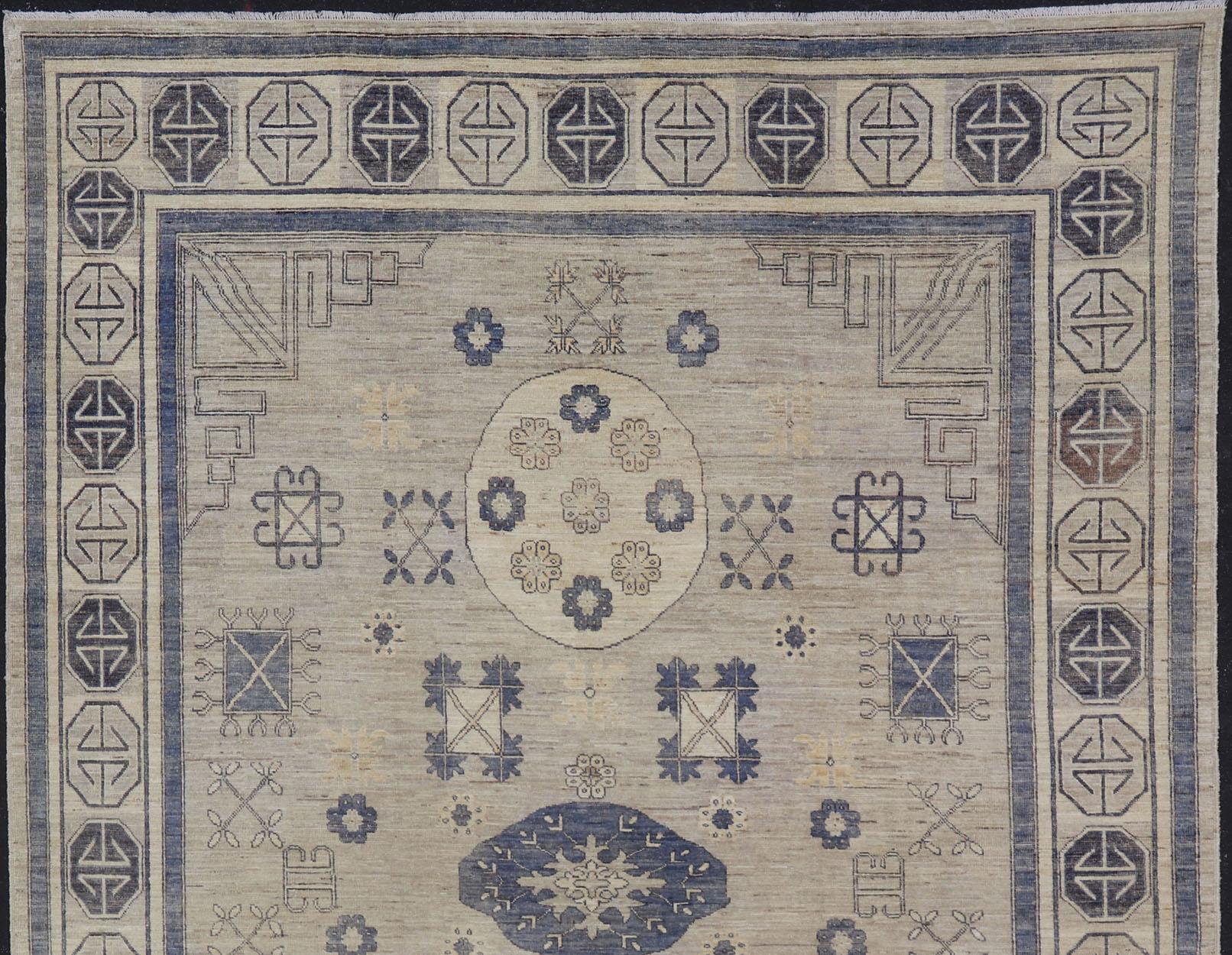 Khotan Design rug with Geometric Medallions in royal blue and ivory, Geometric Khotan rug AFG-36099, Keivan Woven Arts / country of origin / type: Afghanistan / Khotan

This Khotan features multi-medallion geometric design flanked by a repeating