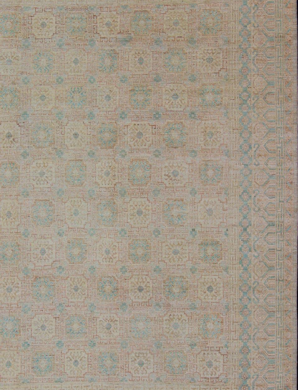 Khotan Design rug with Geometric Medallions in turquoise and tan, Geometric Khotan. Keivan Woven Arts, rug MP-1903-10235, country of origin / type: Afghanistan / Khotan

This Khotan features multi-medallion geometric design flanked by a repeating