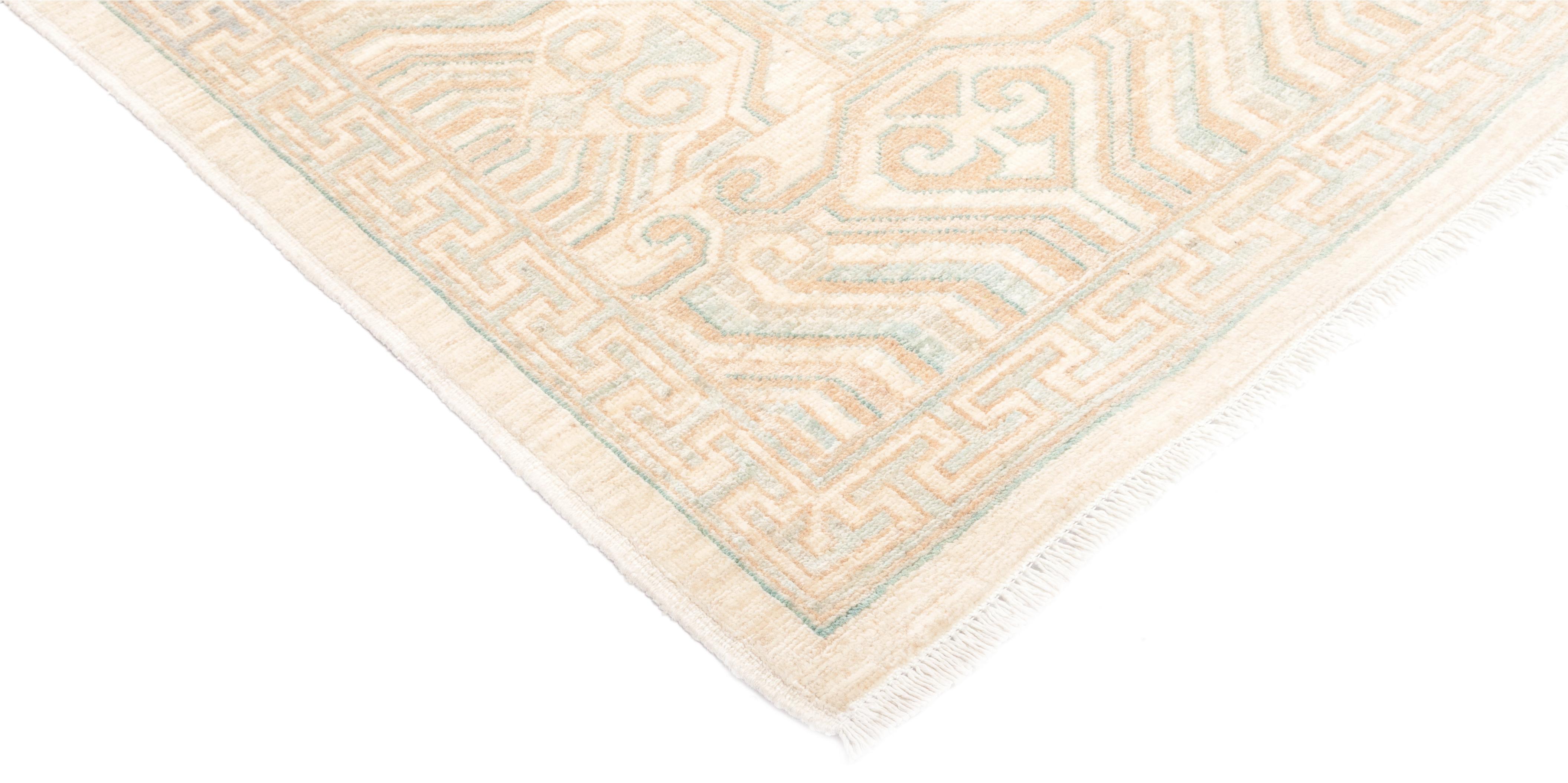 These rugs develop the decorative schemes of late 19th century Turkish carpets. These rugs have large simplified patterns in light tonalities featuring ivory, pale blue, rust, salmon and light green. The origin of these patterns derive from Persia,