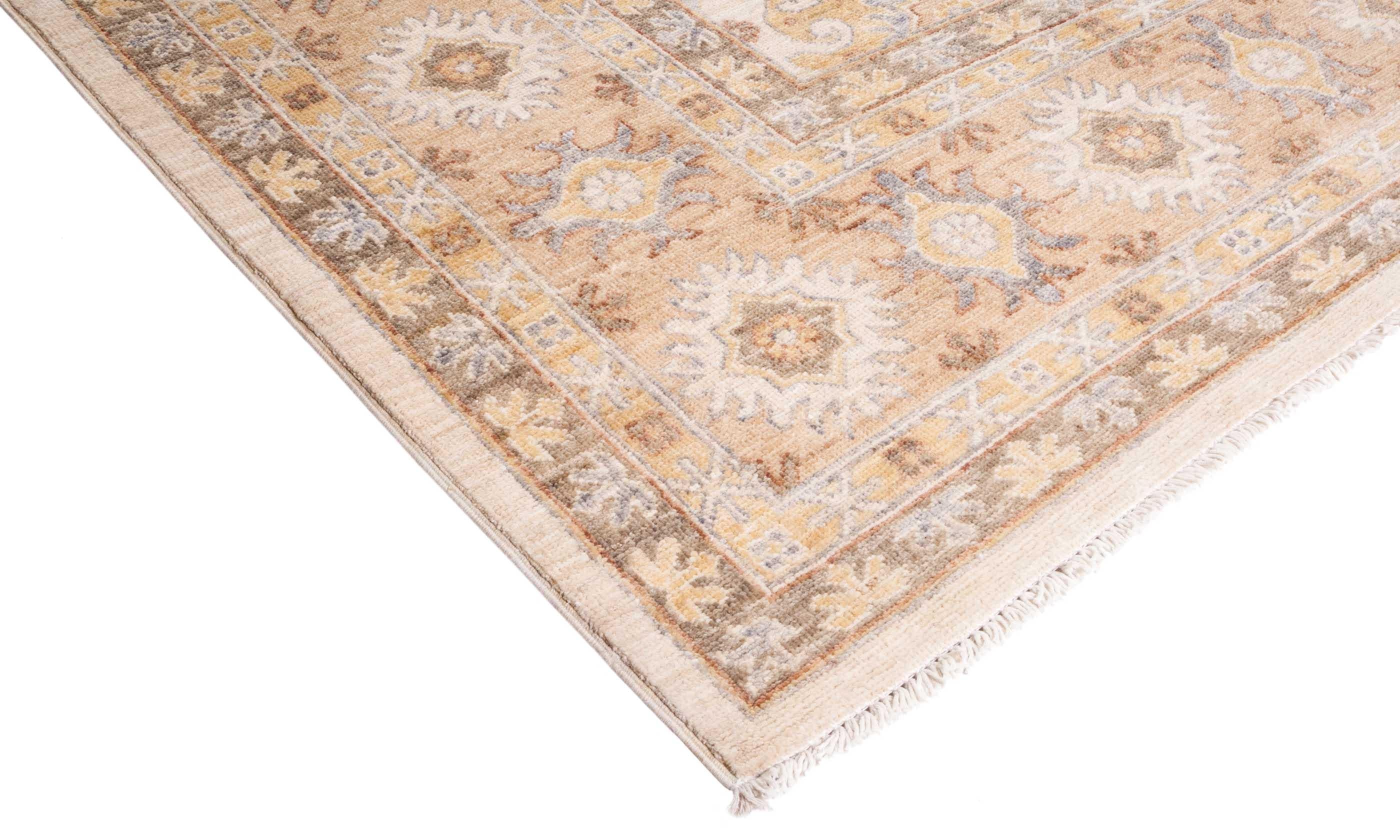 Color: Ivory - Made In: Pakistan. 100% Wool. The city of Khotan was a key trading post along the Silk Road, and the rugs woven there for centuries incorporated Chinese, Persian, and Western influences. Hand-knotted of soft, durable wool, this