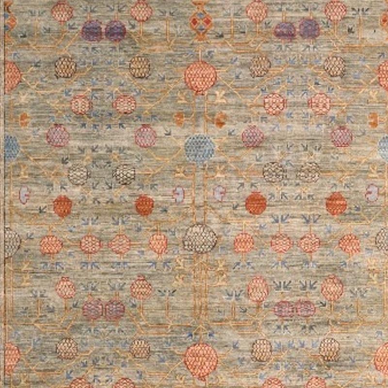 A medium sized rug with traditional Khotan style design. The pile is made of high end quality wool - hand spun, hand dyed with all vegetable dyes and knotted by master weavers. The rug is very decorative and has a towards square format. The