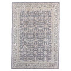 Tapis de style Khotan avec fond corail et motifs bleus