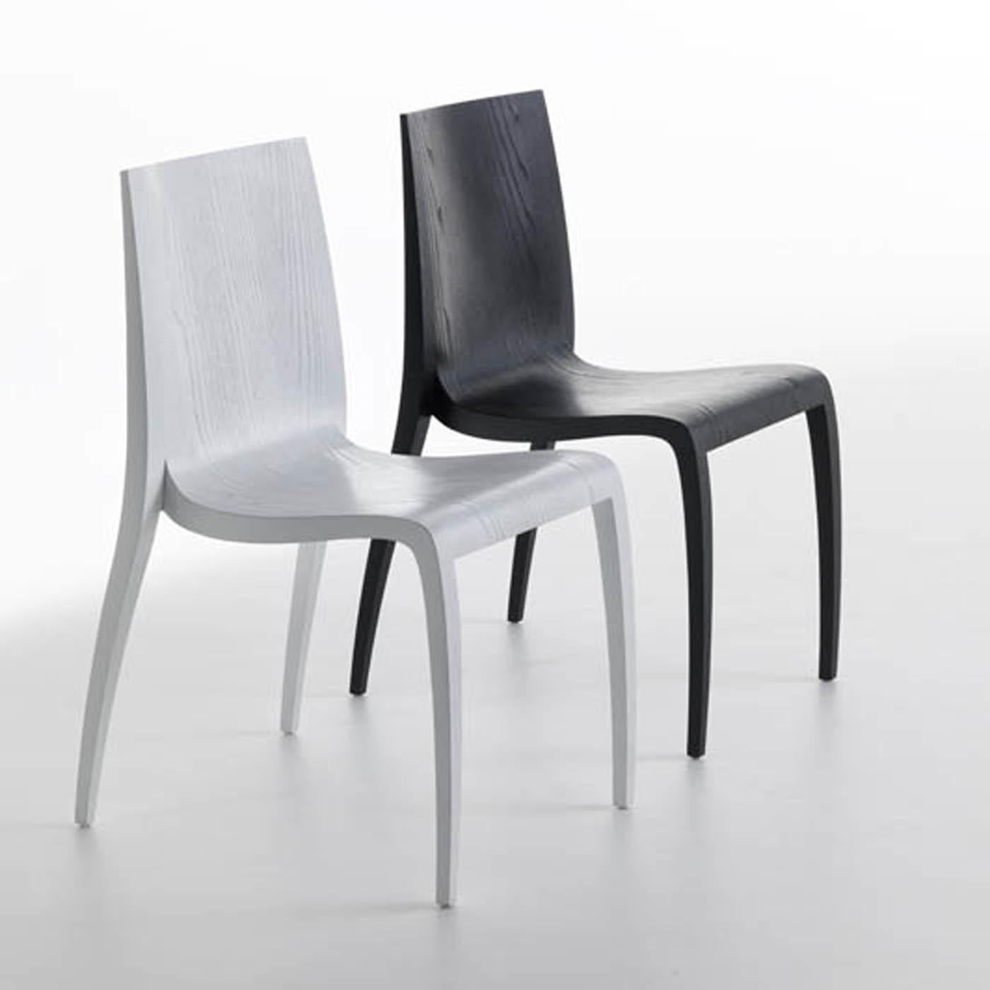 Inspired by the Japanese concept of energy enclosed in the word “ki”, Mario Bellini designed this exquisite contemporary chair boasting an elegant yet simple silhouette. Sinuous and lightweight, the legs are made of ash wood with an open-pore