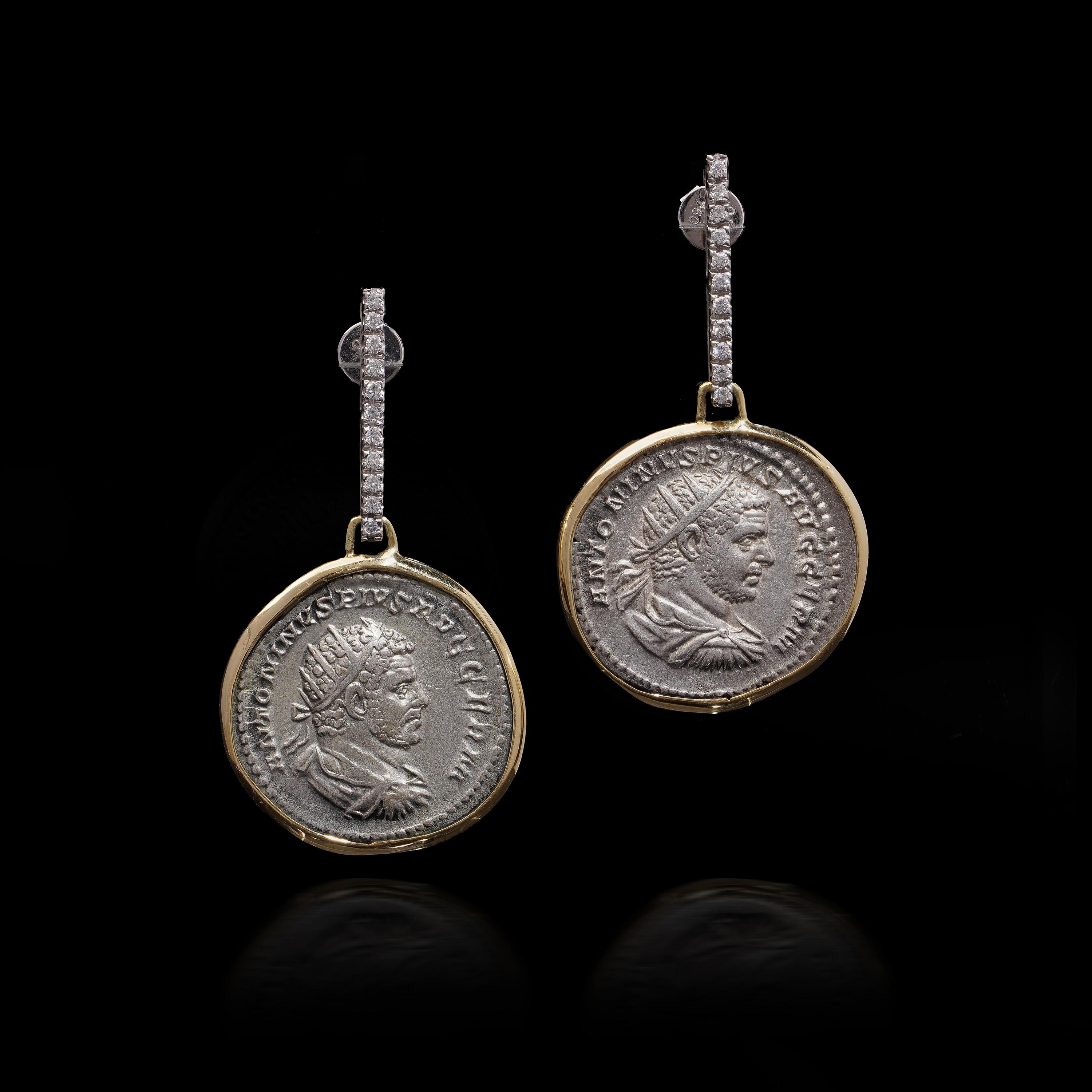 Kiai 18kt Gold and Silver Roman Coin Earrings with Diamonds

These distinctive earrings feature genuine Roman silver coins (denarii) from the reign of Emperor Caracalla, dating to 215 AD. The coins are set in 18kt gold and are adorned with 22