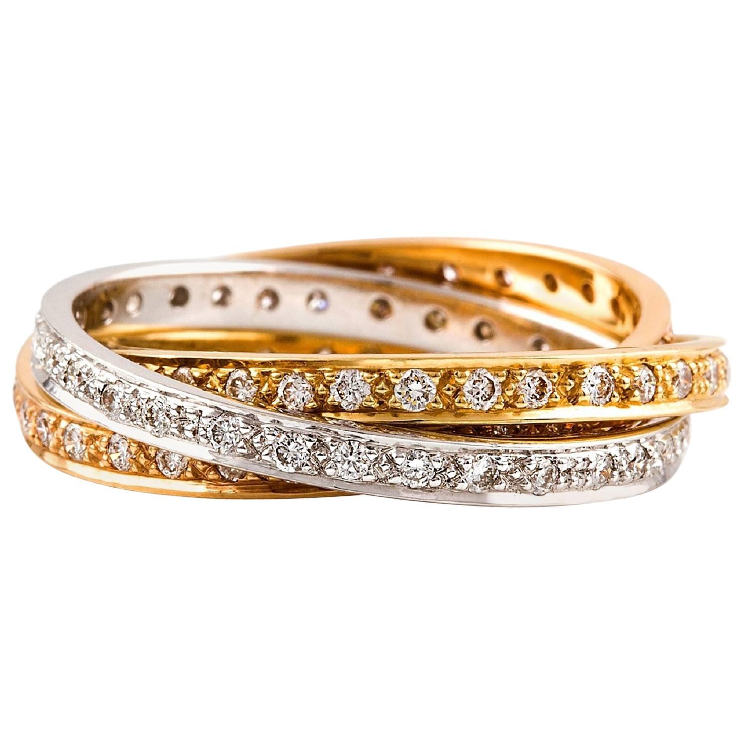 Russo  Diamante Ring

The multi-gold - a mix of 18 carat white, yellow and rose golds, makes this Russian wedding ring a standout. Consisting of three interlocking bands, also known as a trinity ring, enhances the sparkle of the diamond with