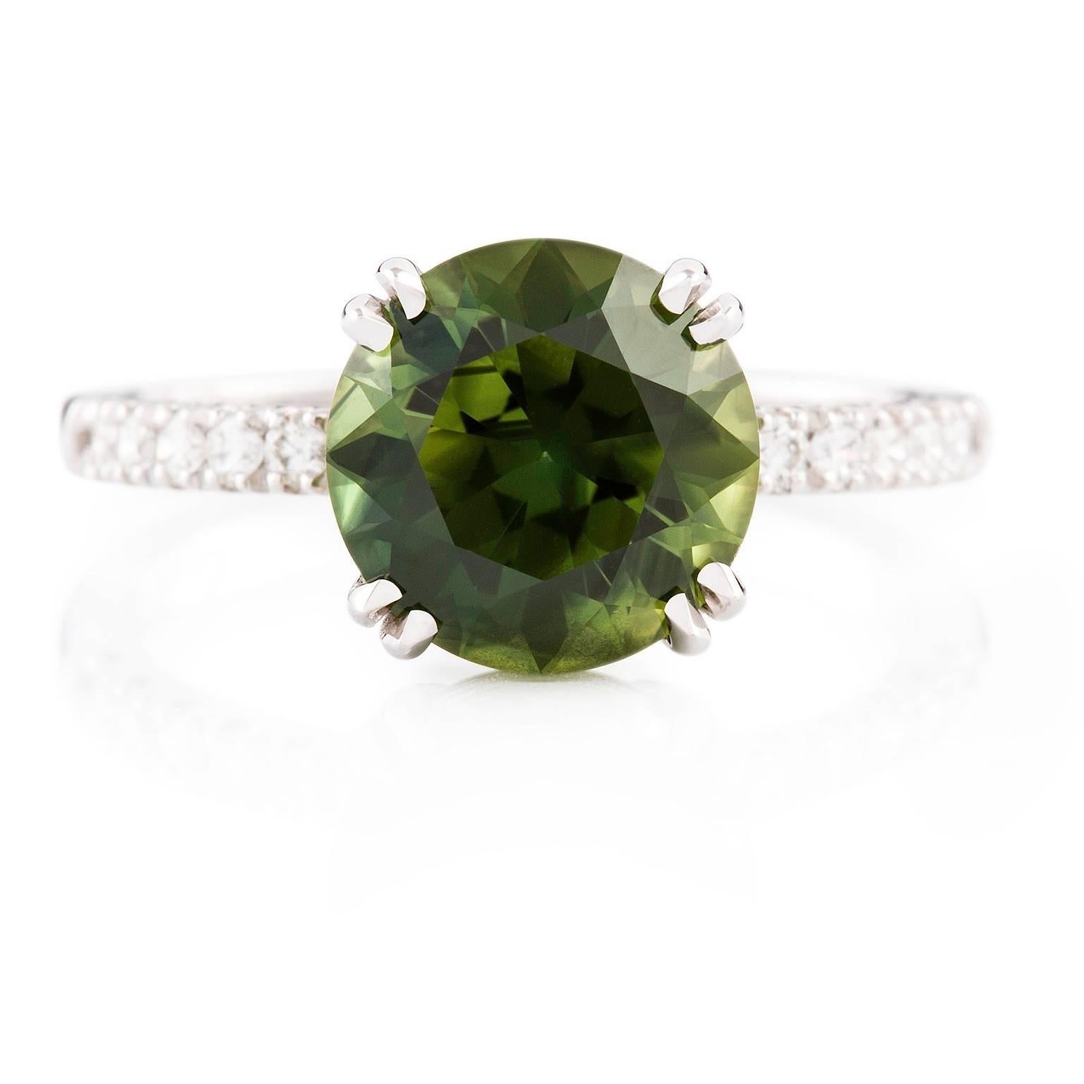 
Verde & Bianca Ring

Simply charming! This 18ct white gold ring is set with a beautiful green sapphire which has petite finest white diamonds on either side.

Round faceted sapphire: medium blue-green colour, 3.67ct

Round brilliant cut diamonds: F