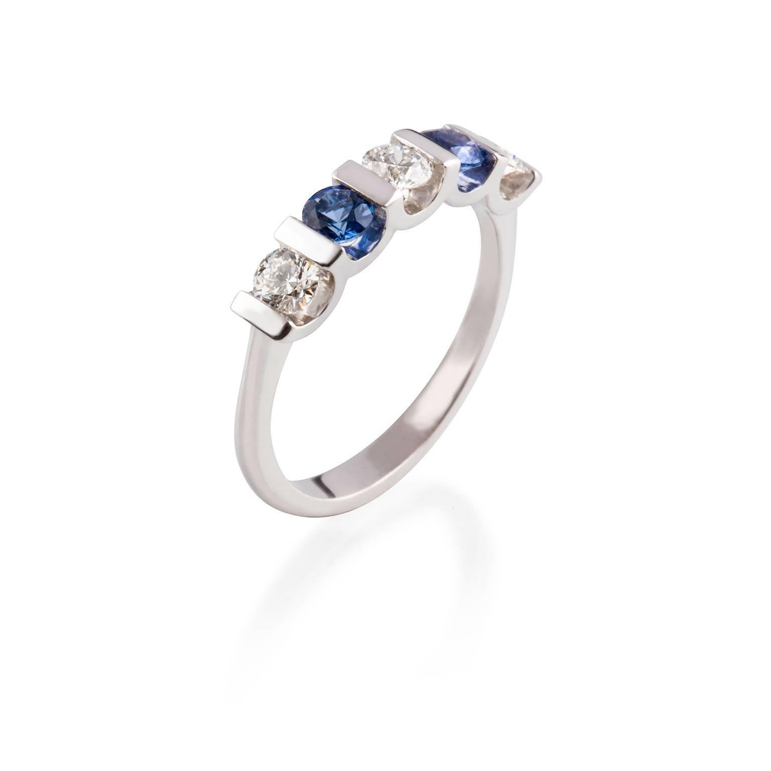 Oceania Ring

This classic 18ct white gold band with alternating Ceylon sapphires and diamonds is both understated and elegant.  

Round faceted sapphires: medium blue colour, Ceylon origin, 3.66 x 3.69mm, 
0.62ct total weight

Round brilliant cut