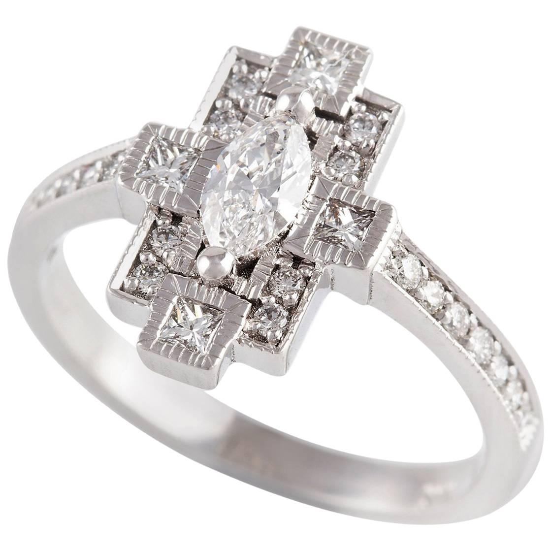  Diamante Ring

This beautiful ring is set with mixed cut white diamonds with fancy textured and milgrain detailing.

1 x Marquise cut diamond: F colour, VS1 clarity, 0.31ct 

4 x Princess cut diamonds: G colour, SI1 claroty, 0.05ct each

8 x Round