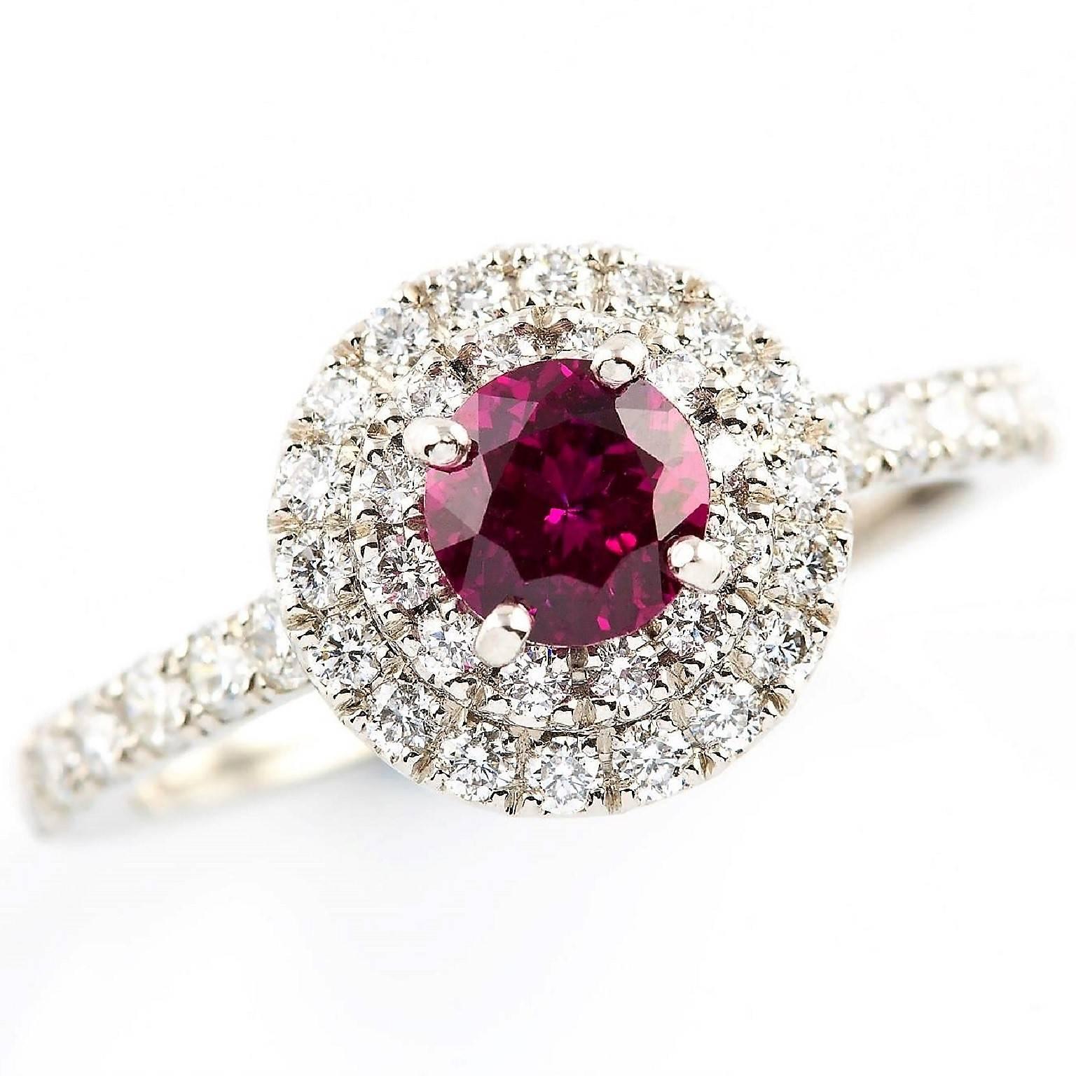 Rubino Halo Ring

This stunning platinum ring is set with an extraordinary round Burmese ruby complemented with a halo of diamonds. The diamonds are also set into the band. A distinctive heirloom piece.

Round faceted ruby: Deep bright pink, Burma