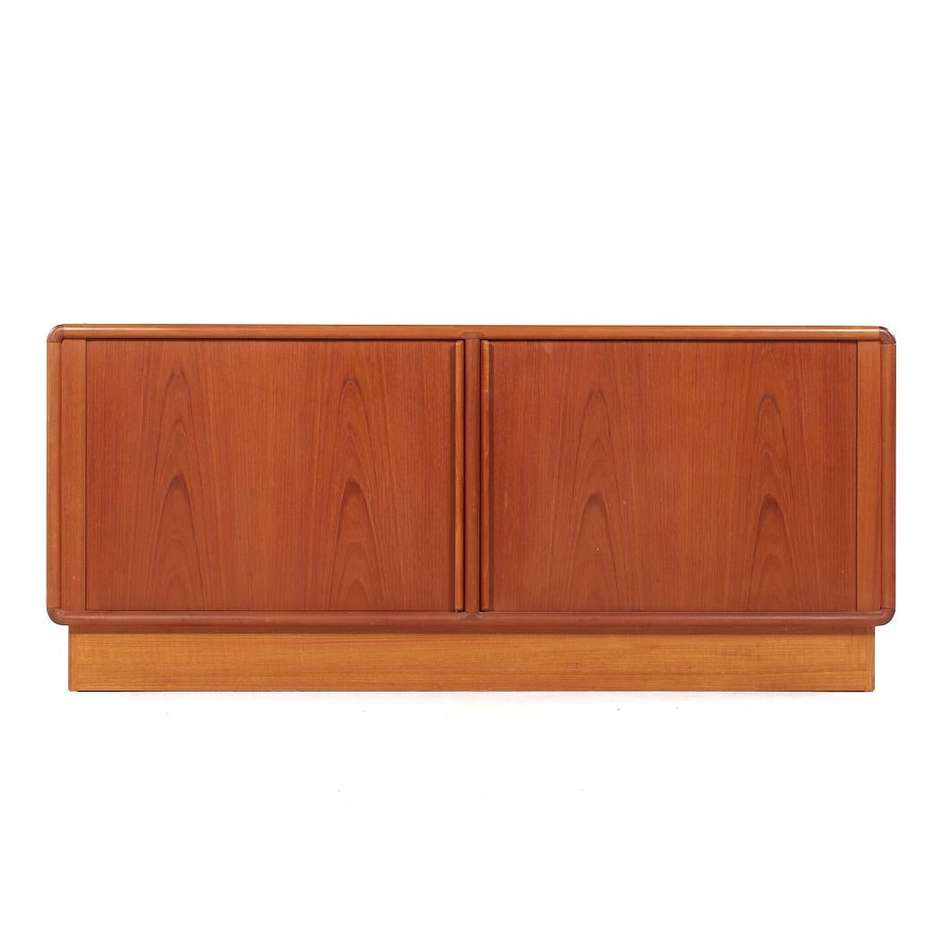 Kibaek Mobelfabrik Mid Century Danish Teak Tambour Door Credenza

This credenza measures: 71 wide x 19 deep x 30.75 inches high

All pieces of furniture can be had in what we call restored vintage condition. That means the piece is restored upon