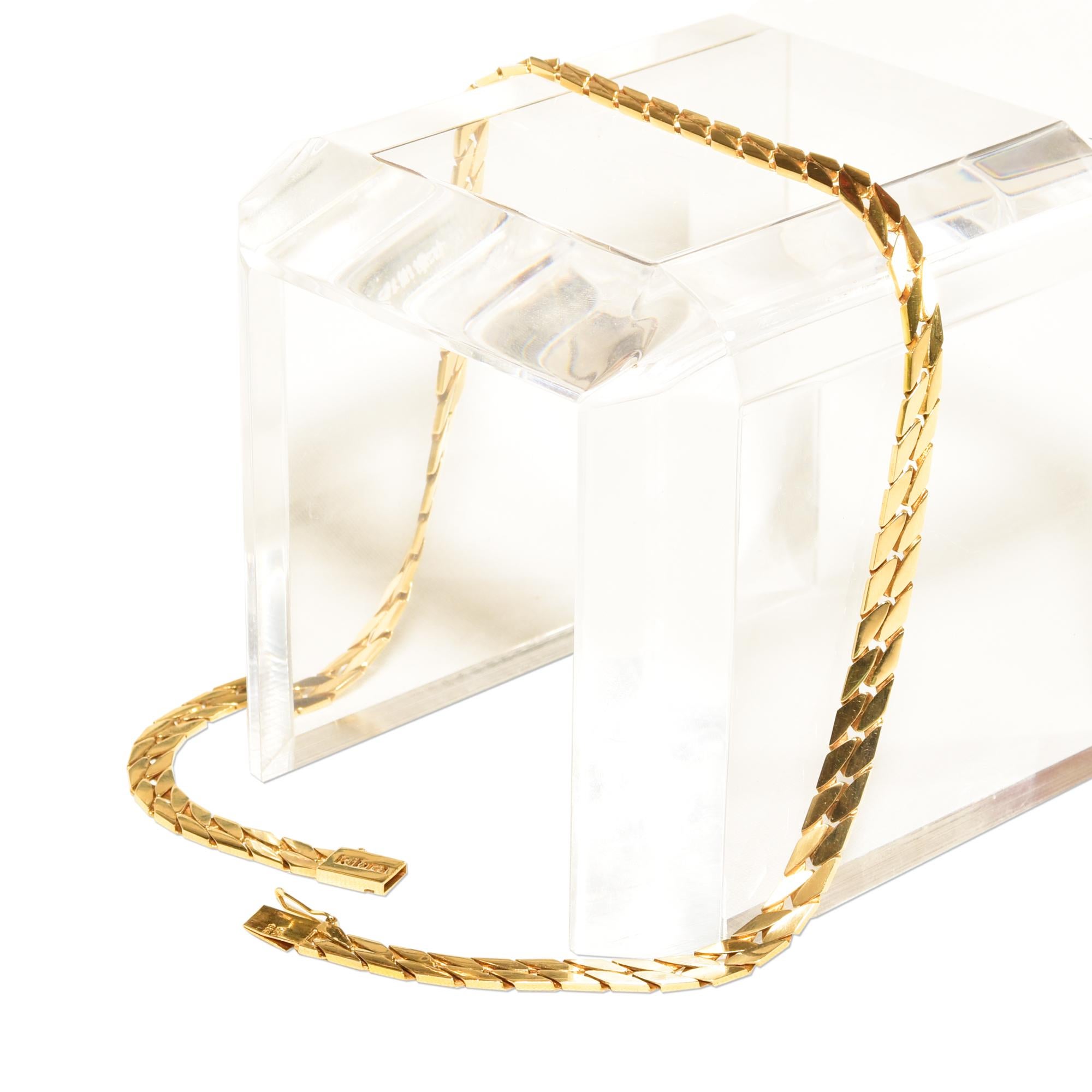 Sleek and solid 14K yellow gold curb chain by unknown designer 'Kibra'. An absolute staple for a sophisticated jewelry collection. 

Features a smooth articulated design with flat angled links and a clean polished finish. Has a comfortable weighted