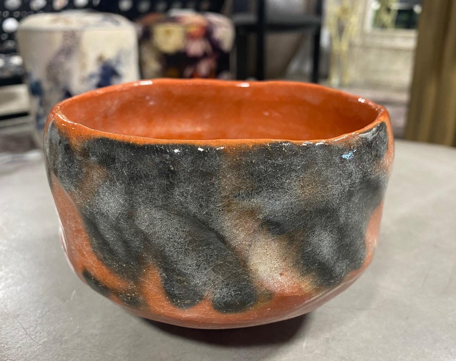 A wonderfully glazed, impeccably made Chawan tea bowl by famed Japanese master potter the 13th Kichizaemon Raku, Seinyu (1887-1944) who was the eldest son of Konyu - the 12th Kichizaemon of the Raku family line of potters - known as the most noted