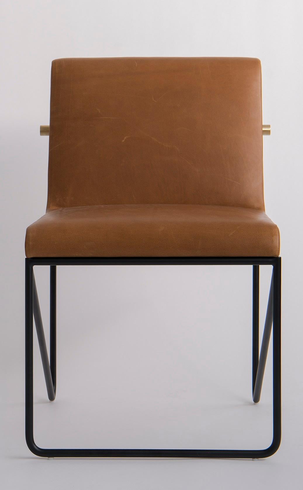 Kickstand Armless Side Chair by Phase Design
Dimensions: D 63.5 x W 55.9 x H 79.4 cm. 
Materials: Leather, powder-coated metal and brushed brass.

Solid steel bar available in a flat black or white powder coat finish with solid brushed brass bar and