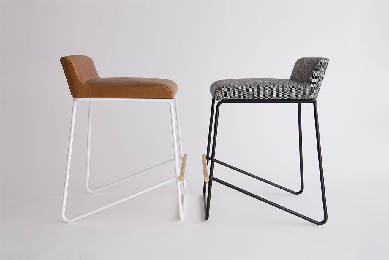 Listed price is for the Kickstand counter stool in powder coat (flat black or flat white) with a solid brushed brass footrest and Hallingdal by Kvadrat fabric.
COM is also available, with a List price of $ 1,990.00.
The Kickstand Counter stool is