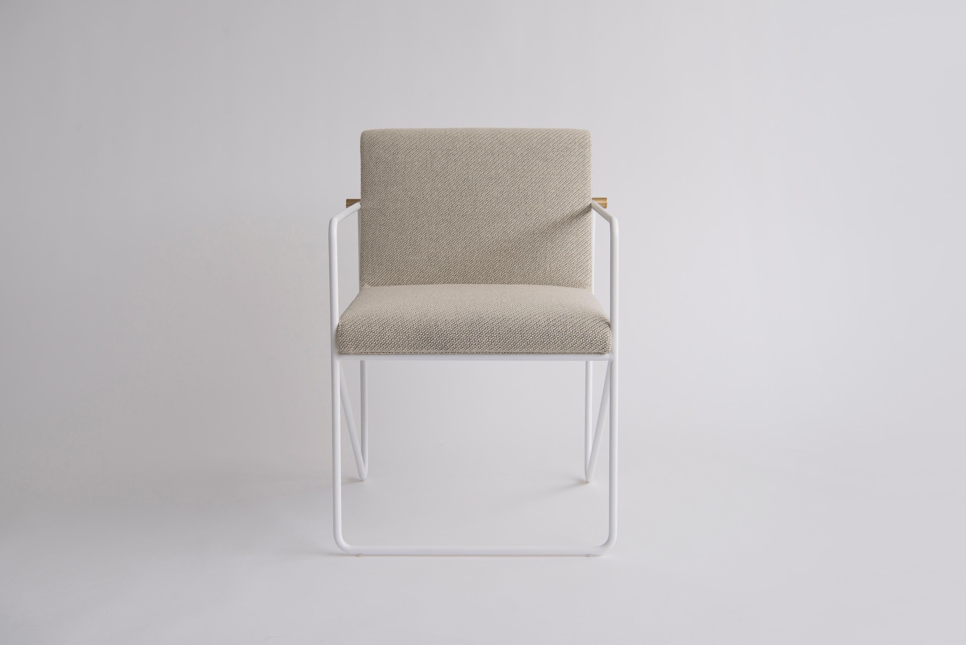 Kickstand Side Chair With Arms by Phase Design
Dimensions: D 63.5 x W 59.1 x H 79.4 cm. 
Materials: Upholstery, powder-coated metal and brushed brass.

Solid steel bar available in a flat black or white powder coat finish with solid brushed brass