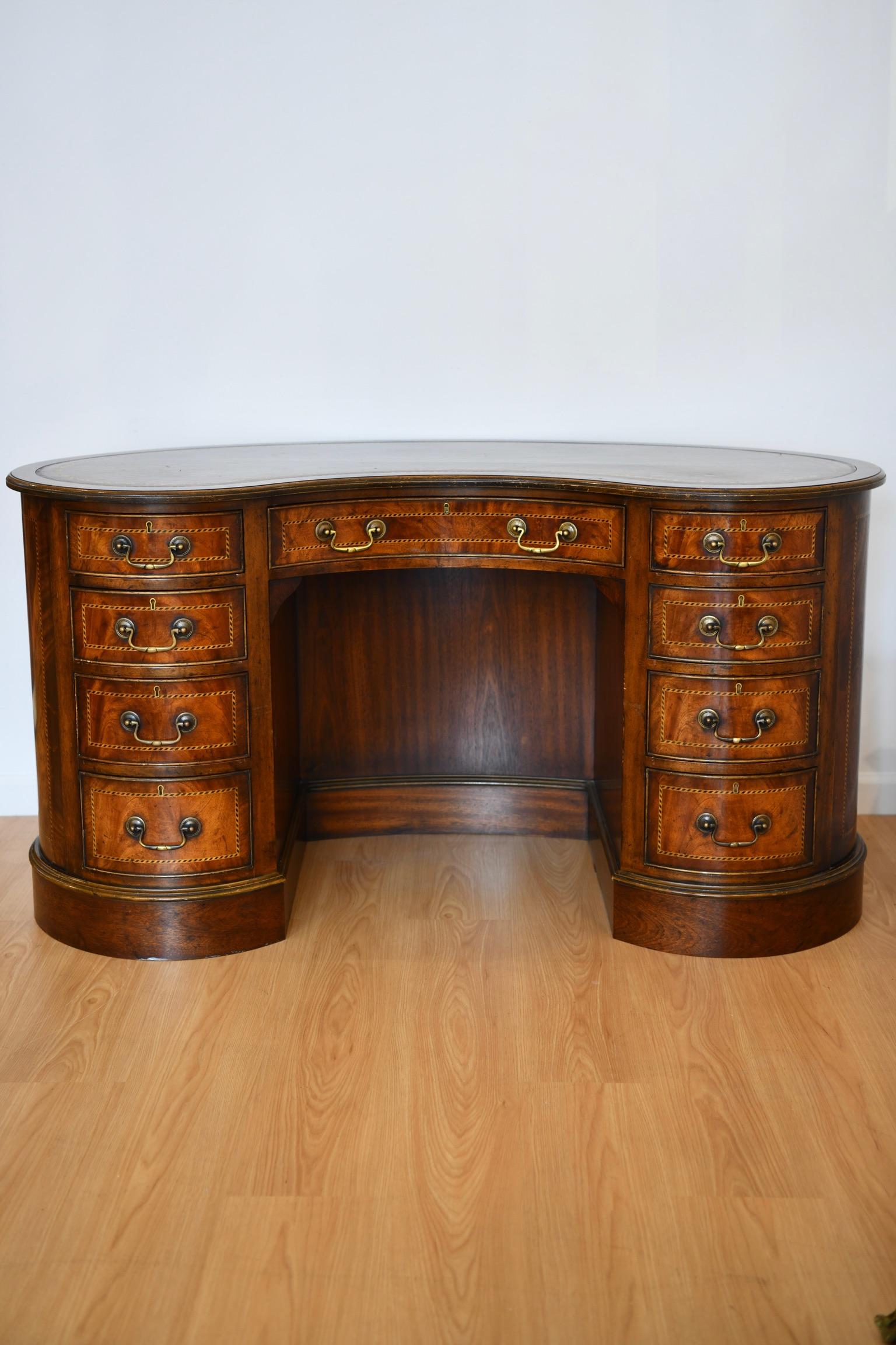 Kidney shaped kneehole desk with leather top by Yorkshire House Inc, High Point North Carolina. Dimensions: 30