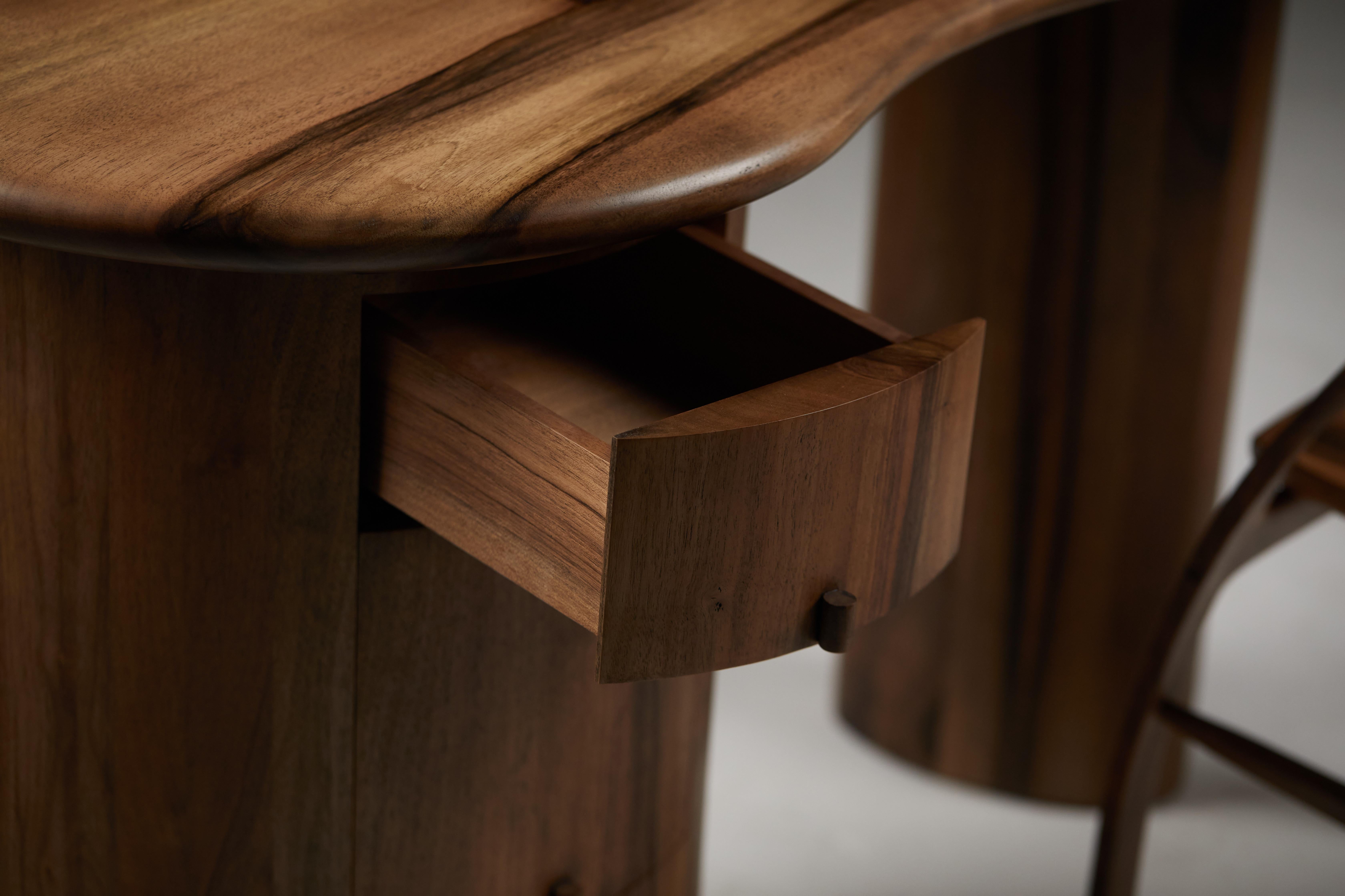 British Kidney shaped desk with pebble edge top in European walnut by Jonathan Field For Sale