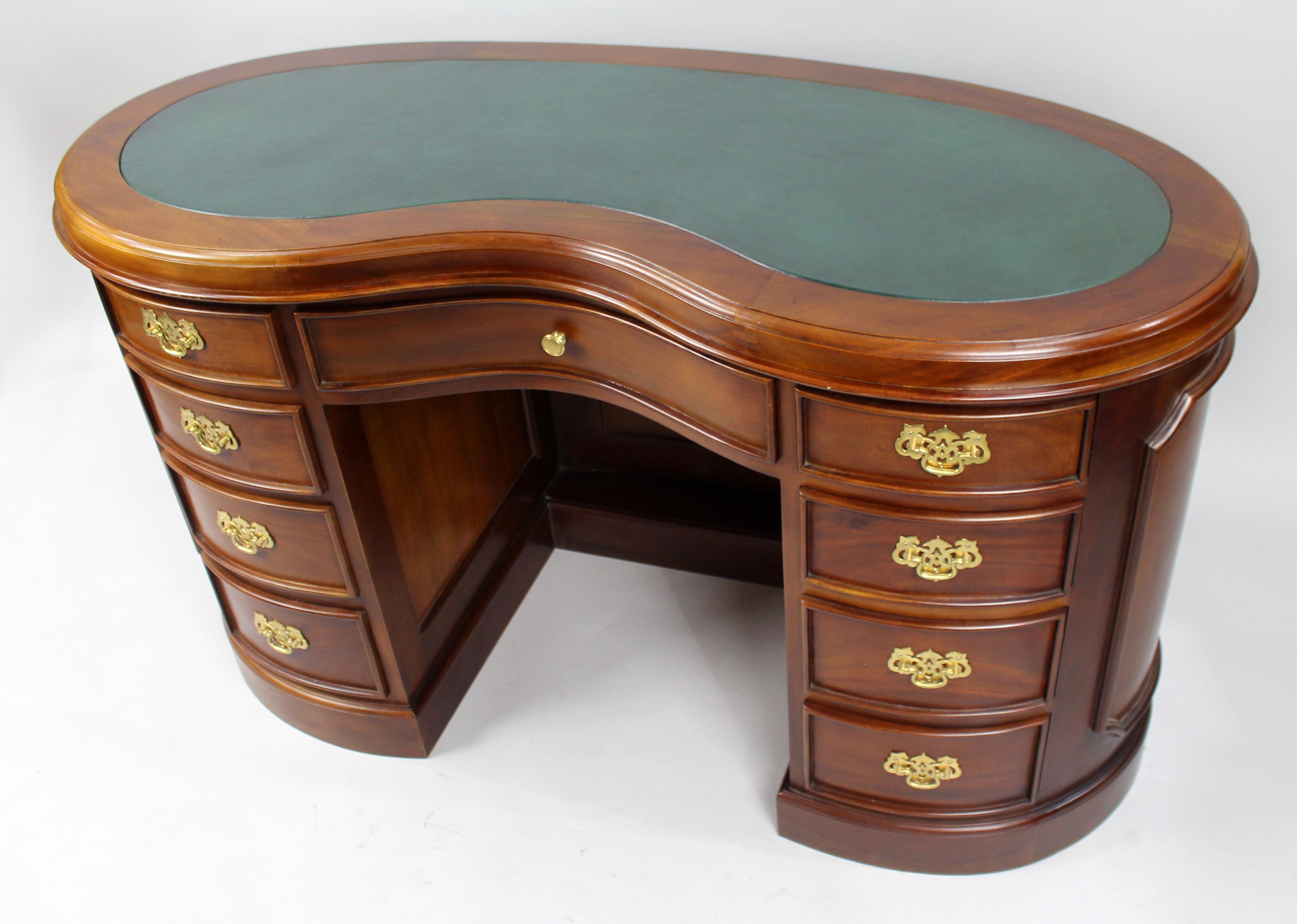 Kidney Shaped Mahogany Leather Topped Desk


We are pleased to offer a lovely quality hand crafted solid mahogany desk.

Kidney shaped with green inset leather top. Rich mahogany body with four drawers to either side of the kneehole and a