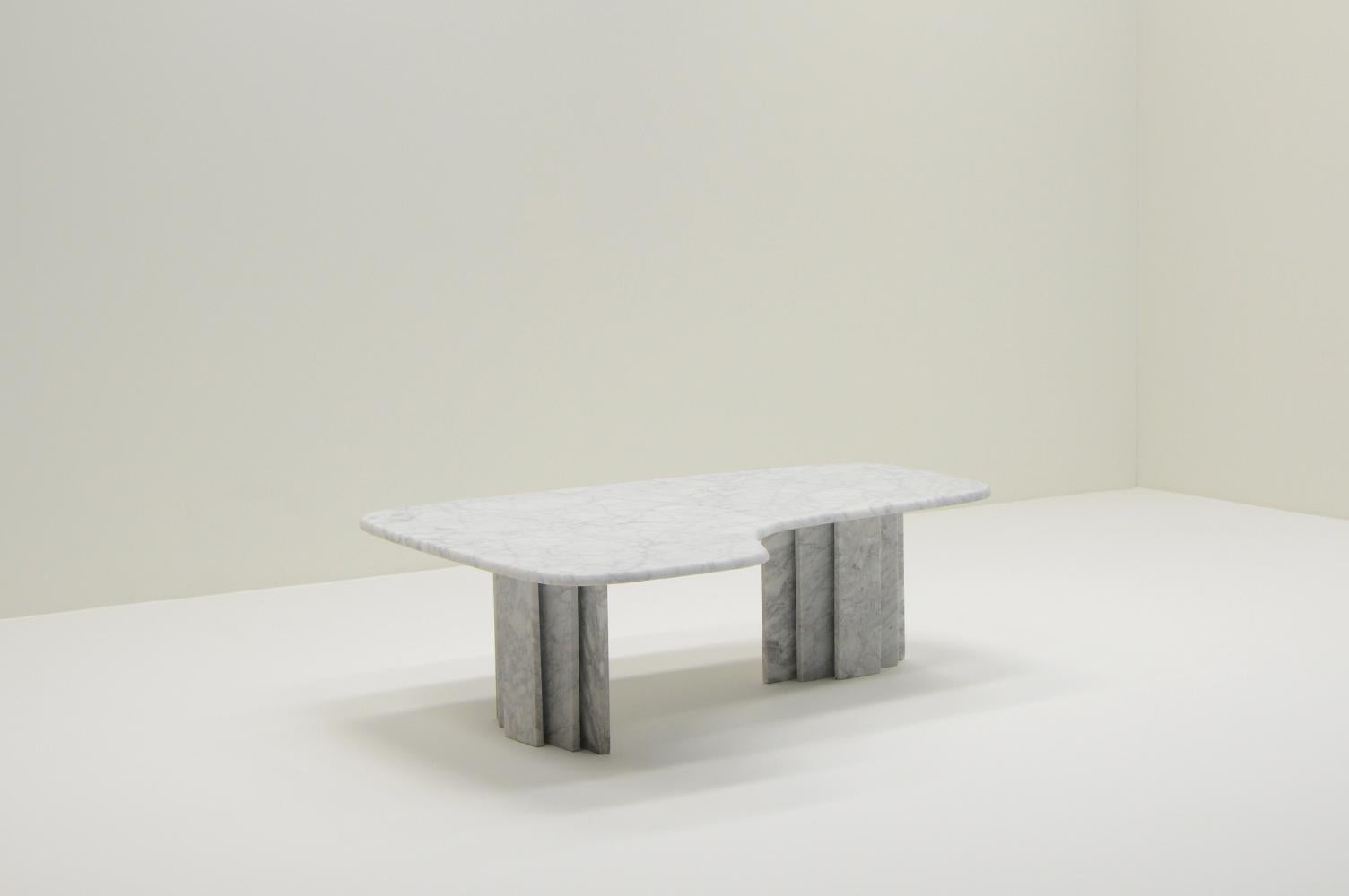 Kidney shaped marble coffee table, 1970s Italy. Solid bianco Carrara marble. Top and legs are separate. Top is refinished with a matt shine. In very good vintage condition. 

Request a quote for the latest shipping rates.
