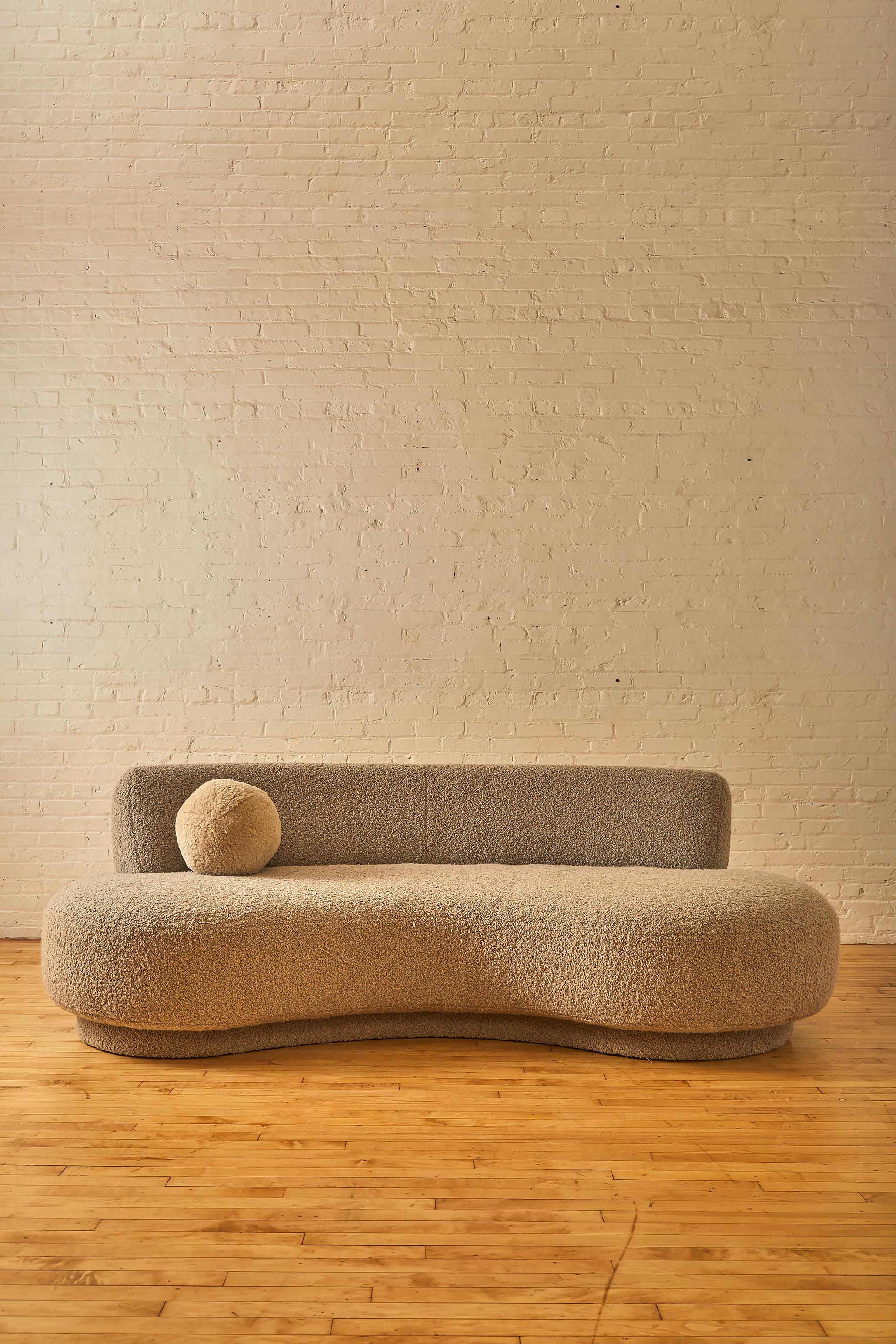Mid Century Modern kidney sofa by Vladamir Kagan. Reupholstered in boucle. 