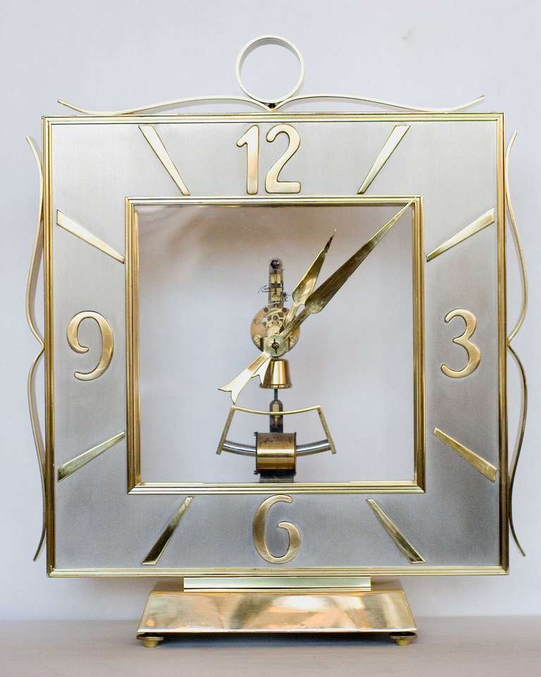 A stunning Kieninger & Obergfell brass mantel clock of epic proportions. This breathtaking clock is stamped: 