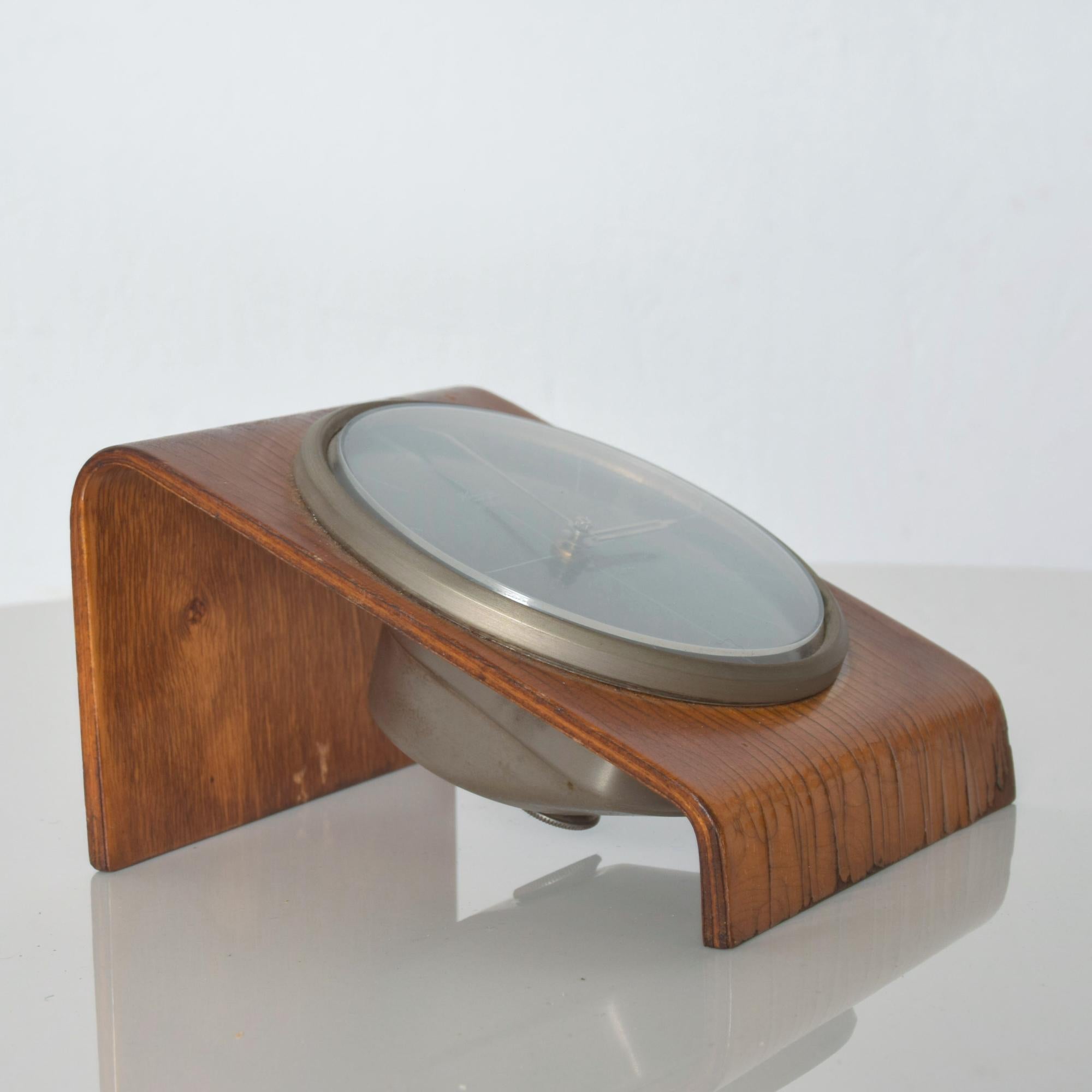 Desk Clock
Kienzle Modern Bentwood Desk Table Clock Brown & Silver made in Germany 1960s
Fabulous patinated waterfall effect on bentwood case also includes plexiglass and metal.
5D x 4.38 W x 3 H.
1960s Stylishly modern case electro-mechanical