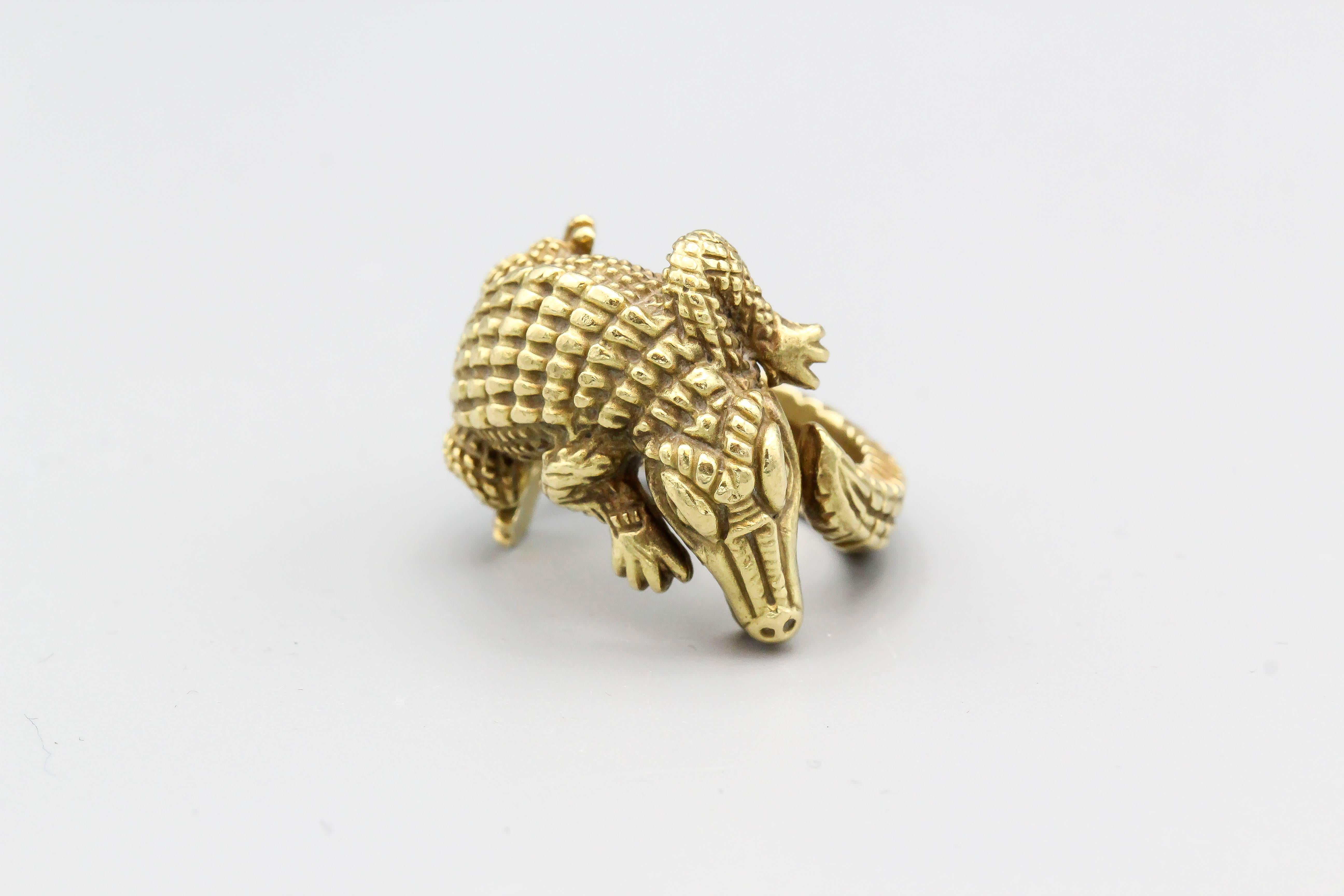 Fine 18K gold alligator ring by Kieselstein-Cord, circa 1988. Designed as an alligator wrapping head to tail around the finger, this whimsical ring offer fine detail and arguably Kieselstein's most famed animal motif.  Currently a size 5, but could