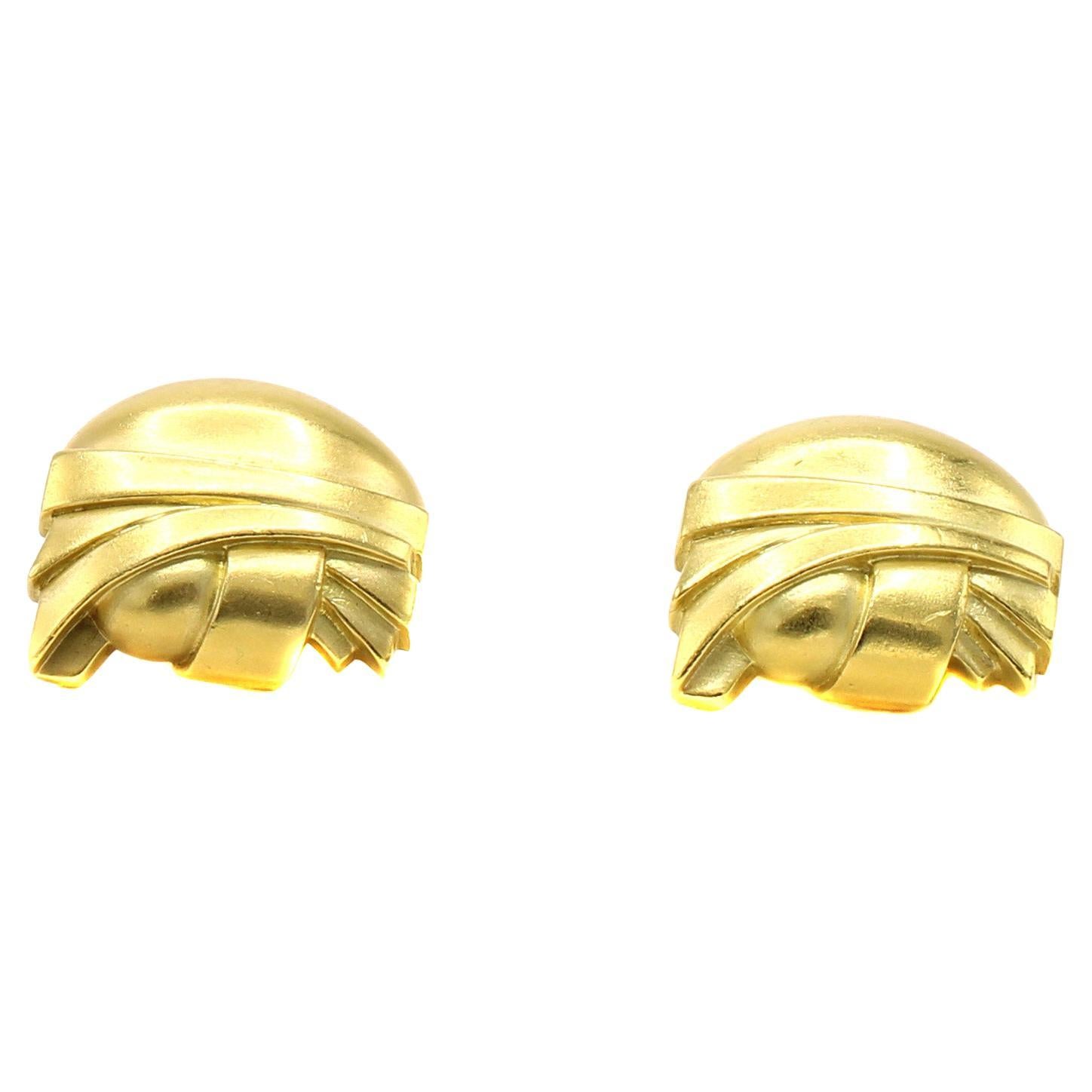 Beautifully designed and masterfully handcrafted by the iconic American jeweler Barry Kieselstein-Cord, these large and impressive ear clips make a statement on every ear. The distinctive matt finish of the green toned gold and architectural design